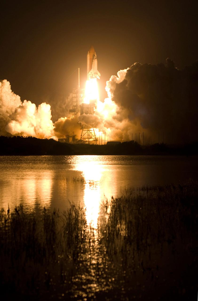 STS119-S-035 (15 March 2009) --- The Space Shuttle Discovery and its seven-member STS-119 crew head toward Earth orbit and a scheduled link-up with the International Space Station. Liftoff was on time at 7:43 p.m. (EDT) on March 15, 2009 from launch pad 39A at NASA’s Kennedy Space Center. Onboard are astronauts Lee Archambault, commander; Tony Antonelli, pilot; Joseph Acaba, Steve Swanson, Richard Arnold, John Phillips and Japan Aerospace Exploration Agency’s Koichi Wakata, all mission specialists. Wakata will join Expedition 18 in progress to serve as a flight engineer aboard the space station. Discovery will deliver the final pair of power-generating solar array wings and the S6 truss segment. Installation of S6 will signal the station's readiness to house a six-member crew for conducting increased science.