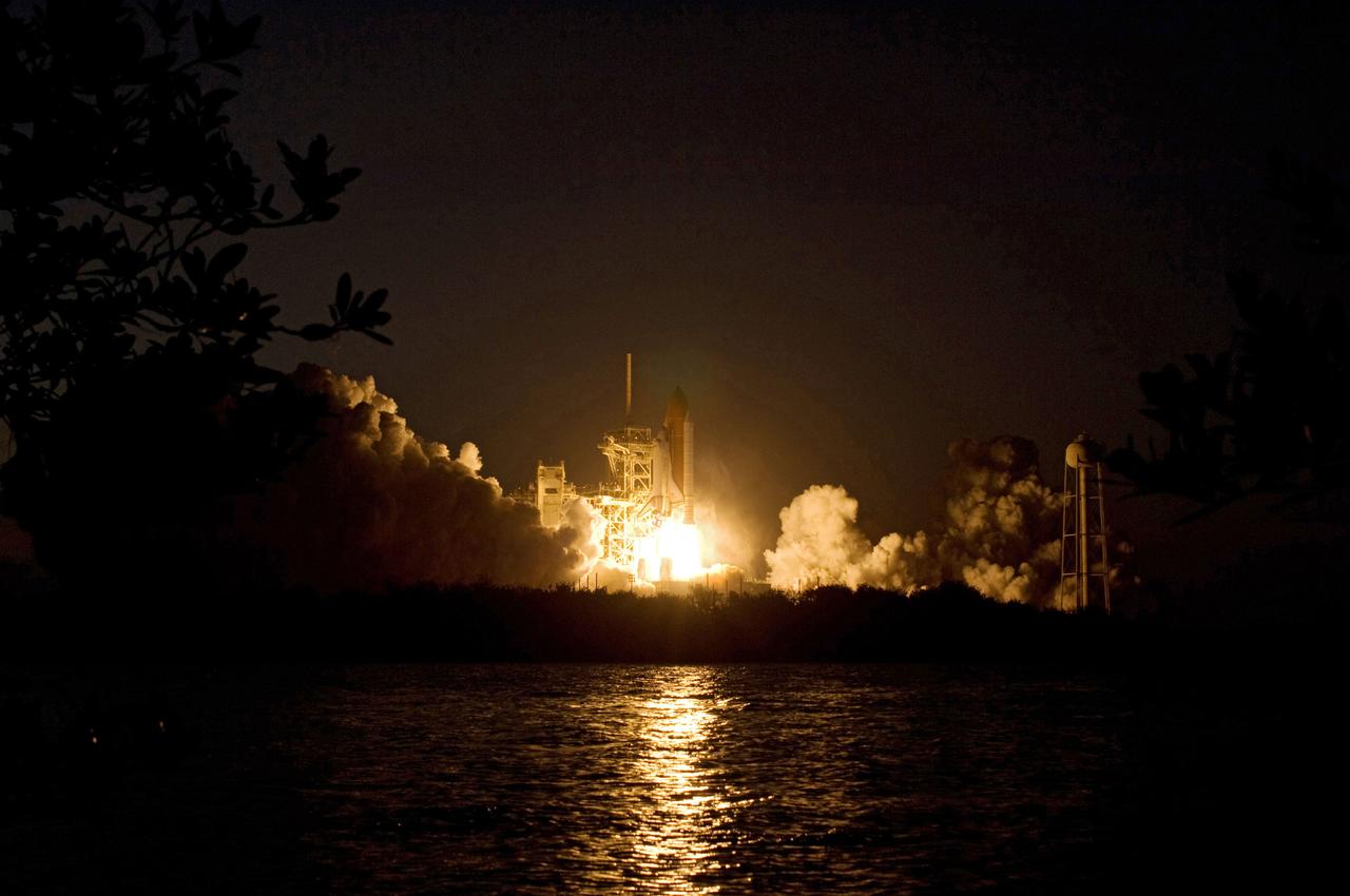 STS119-S-036 (15 March 2009) --- The Space Shuttle Discovery and its seven-member STS-119 crew head toward Earth orbit and a scheduled link-up with the International Space Station. Liftoff was on time at 7:43 p.m. (EDT) on March 15, 2009 from launch pad 39A at NASA’s Kennedy Space Center. Onboard are astronauts Lee Archambault, commander; Tony Antonelli, pilot; Joseph Acaba, Steve Swanson, Richard Arnold, John Phillips and Japan Aerospace Exploration Agency’s Koichi Wakata, all mission specialists. Wakata will join Expedition 18 in progress to serve as a flight engineer aboard the space station. Discovery will deliver the final pair of power-generating solar array wings and the S6 truss segment. Installation of S6 will signal the station's readiness to house a six-member crew for conducting increased science.