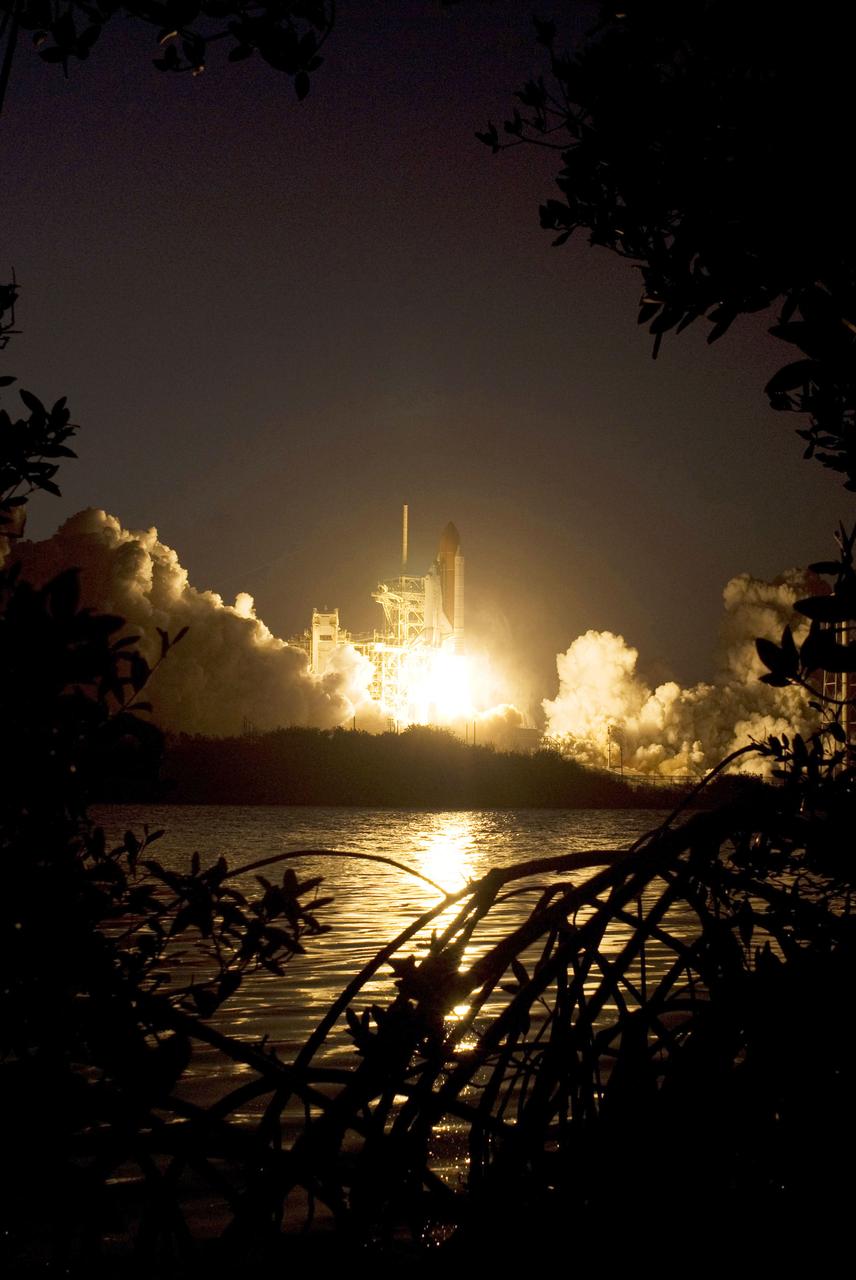 STS119-S-038 (15 March 2009) --- The Space Shuttle Discovery and its seven-member STS-119 crew head toward Earth orbit and a scheduled link-up with the International Space Station. Liftoff was on time at 7:43 p.m. (EDT) on March 15, 2009 from launch pad 39A at NASA’s Kennedy Space Center. Onboard are astronauts Lee Archambault, commander; Tony Antonelli, pilot; Joseph Acaba, Steve Swanson, Richard Arnold, John Phillips and Japan Aerospace Exploration Agency’s Koichi Wakata, all mission specialists. Wakata will join Expedition 18 in progress to serve as a flight engineer aboard the space station. Discovery will deliver the final pair of power-generating solar array wings and the S6 truss segment. Installation of S6 will signal the station's readiness to house a six-member crew for conducting increased science.