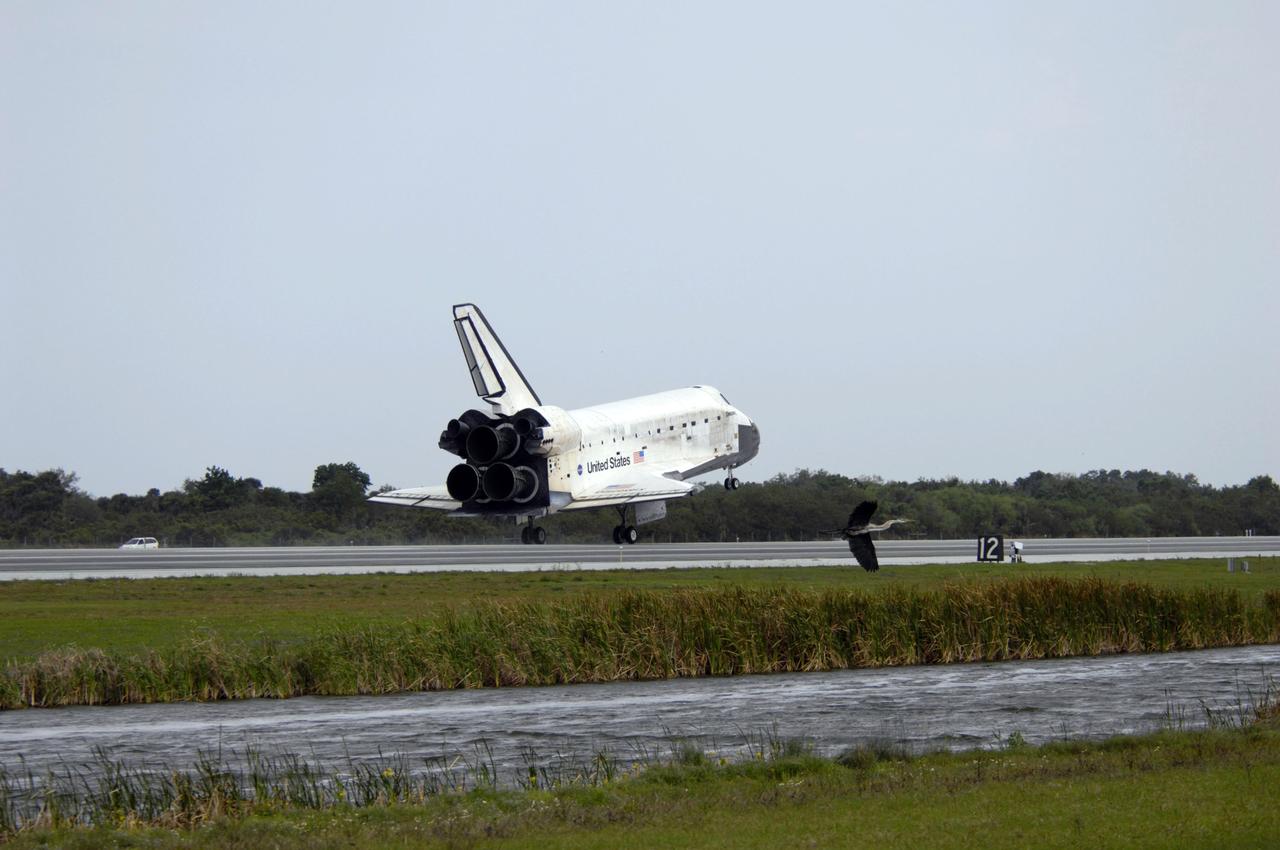 STS119-S-046 (28 March 2009) --- Space Shuttle Discovery touches down on Runway 15 of the Shuttle Landing Facility at NASA's Kennedy Space Center, concluding the 13-day, 5.3-million mile journey of the STS-119 mission to the International Space Station. Onboard are NASA astronauts Lee Archambault, commander; Tony Antonelli, pilot; Steve Swanson, Richard Arnold, Joseph Acaba, John Phillips and Sandra Magnus, all mission specialists. The main landing gear touched down at 3:13:17 p.m. (EDT) on March 28, 2009. The nose gear touched down at 3:13:40 p.m. and wheels stop was at 3:14:45 p.m. During the mission, Discovery?s crew delivered and installed the final pair of large power-generating solar array wings and the S6 truss segment to the starboard, or right, side of the station and accomplished important tasks to prepare the station for future upgrades and additions later this year.