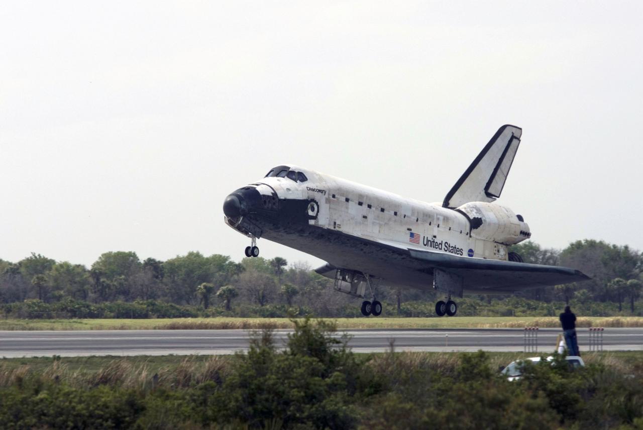 STS119-S-057 (28 March 2009) --- Space Shuttle Discovery approaches landing on Runway 15 of the Shuttle Landing Facility at NASA's Kennedy Space Center, concluding the 13-day, 5.3-million mile journey of the STS-119 mission to the International Space Station. Onboard are NASA astronauts Lee Archambault, commander; Tony Antonelli, pilot; Steve Swanson, Richard Arnold, Joseph Acaba, John Phillips and Sandra Magnus, all mission specialists. The main landing gear touched down at 3:13:17 p.m. (EDT) on March 28, 2009. The nose gear touched down at 3:13:40 p.m. and wheels stop was at 3:14:45 p.m. During the mission, Discovery?s crew delivered and installed the final pair of large power-generating solar array wings and the S6 truss segment to the starboard, or right, side of the station and accomplished important tasks to prepare the station for future upgrades and additions later this year.