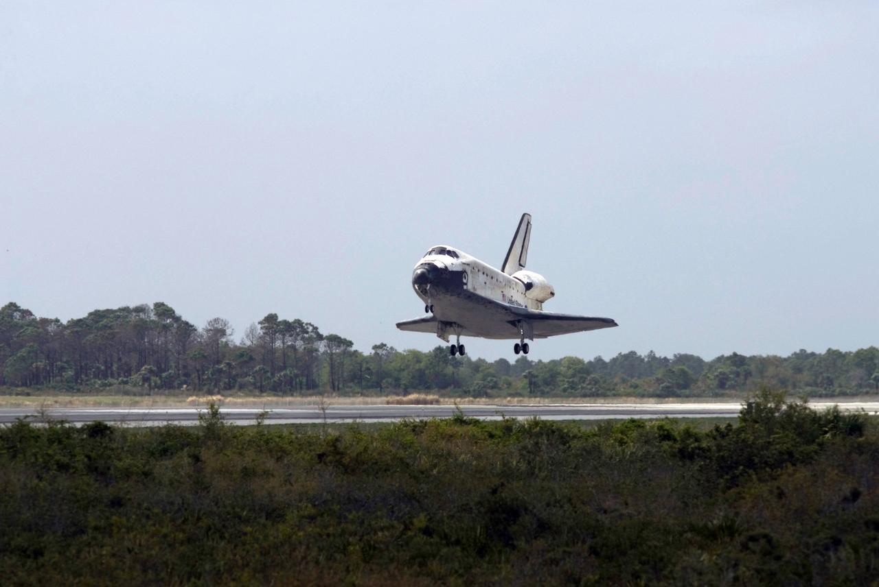 STS119-S-059 (28 March 2009) --- Space Shuttle Discovery approaches landing on Runway 15 of the Shuttle Landing Facility at NASA's Kennedy Space Center, concluding the 13-day, 5.3-million mile journey of the STS-119 mission to the International Space Station. Onboard are NASA astronauts Lee Archambault, commander; Tony Antonelli, pilot; Steve Swanson, Richard Arnold, Joseph Acaba, John Phillips and Sandra Magnus, all mission specialists. The main landing gear touched down at 3:13:17 p.m. (EDT) on March 28, 2009. The nose gear touched down at 3:13:40 p.m. and wheels stop was at 3:14:45 p.m. During the mission, Discovery?s crew delivered and installed the final pair of large power-generating solar array wings and the S6 truss segment to the starboard, or right, side of the station and accomplished important tasks to prepare the station for future upgrades and additions later this year.