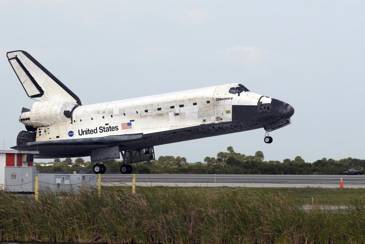 STS119-S-068 (28 March 2009) --- Space Shuttle Discovery touches down on Runway 15 of the Shuttle Landing Facility at NASA's Kennedy Space Center, concluding the 13-day, 5.3-million mile journey of the STS-119 mission to the International Space Station. Onboard are NASA astronauts Lee Archambault, commander; Tony Antonelli, pilot; Steve Swanson, Richard Arnold, Joseph Acaba, John Phillips and Sandra Magnus, all mission specialists. The main landing gear touched down at 3:13:17 p.m. (EDT) on March 28, 2009. The nose gear touched down at 3:13:40 p.m. and wheels stop was at 3:14:45 p.m. During the mission, Discovery?s crew delivered and installed the final pair of large power-generating solar array wings and the S6 truss segment to the starboard, or right, side of the station and accomplished important tasks to prepare the station for future upgrades and additions later this year.
