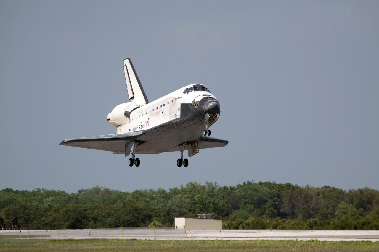 STS119-S-071 (28 March 2009) --- Space Shuttle Discovery approaches landing on Runway 15 of the Shuttle Landing Facility at NASA's Kennedy Space Center, concluding the 13-day, 5.3-million mile journey of the STS-119 mission to the International Space Station. Onboard are NASA astronauts Lee Archambault, commander; Tony Antonelli, pilot; Steve Swanson, Richard Arnold, Joseph Acaba, John Phillips and Sandra Magnus, all mission specialists. The main landing gear touched down at 3:13:17 p.m. (EDT) on March 28, 2009. The nose gear touched down at 3:13:40 p.m. and wheels stop was at 3:14:45 p.m. During the mission, Discovery?s crew delivered and installed the final pair of large power-generating solar array wings and the S6 truss segment to the starboard, or right, side of the station and accomplished important tasks to prepare the station for future upgrades and additions later this year.
