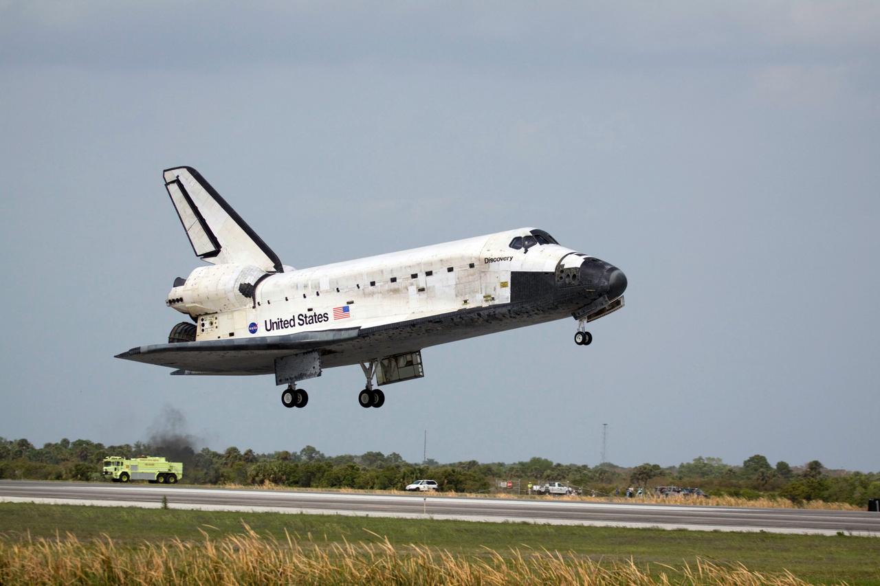 STS119-S-072 (28 March 2009) --- Space Shuttle Discovery approaches landing on Runway 15 of the Shuttle Landing Facility at NASA's Kennedy Space Center, concluding the 13-day, 5.3-million mile journey of the STS-119 mission to the International Space Station. Onboard are NASA astronauts Lee Archambault, commander; Tony Antonelli, pilot; Steve Swanson, Richard Arnold, Joseph Acaba, John Phillips and Sandra Magnus, all mission specialists. The main landing gear touched down at 3:13:17 p.m. (EDT) on March 28, 2009. The nose gear touched down at 3:13:40 p.m. and wheels stop was at 3:14:45 p.m. During the mission, Discovery?s crew delivered and installed the final pair of large power-generating solar array wings and the S6 truss segment to the starboard, or right, side of the station and accomplished important tasks to prepare the station for future upgrades and additions later this year.