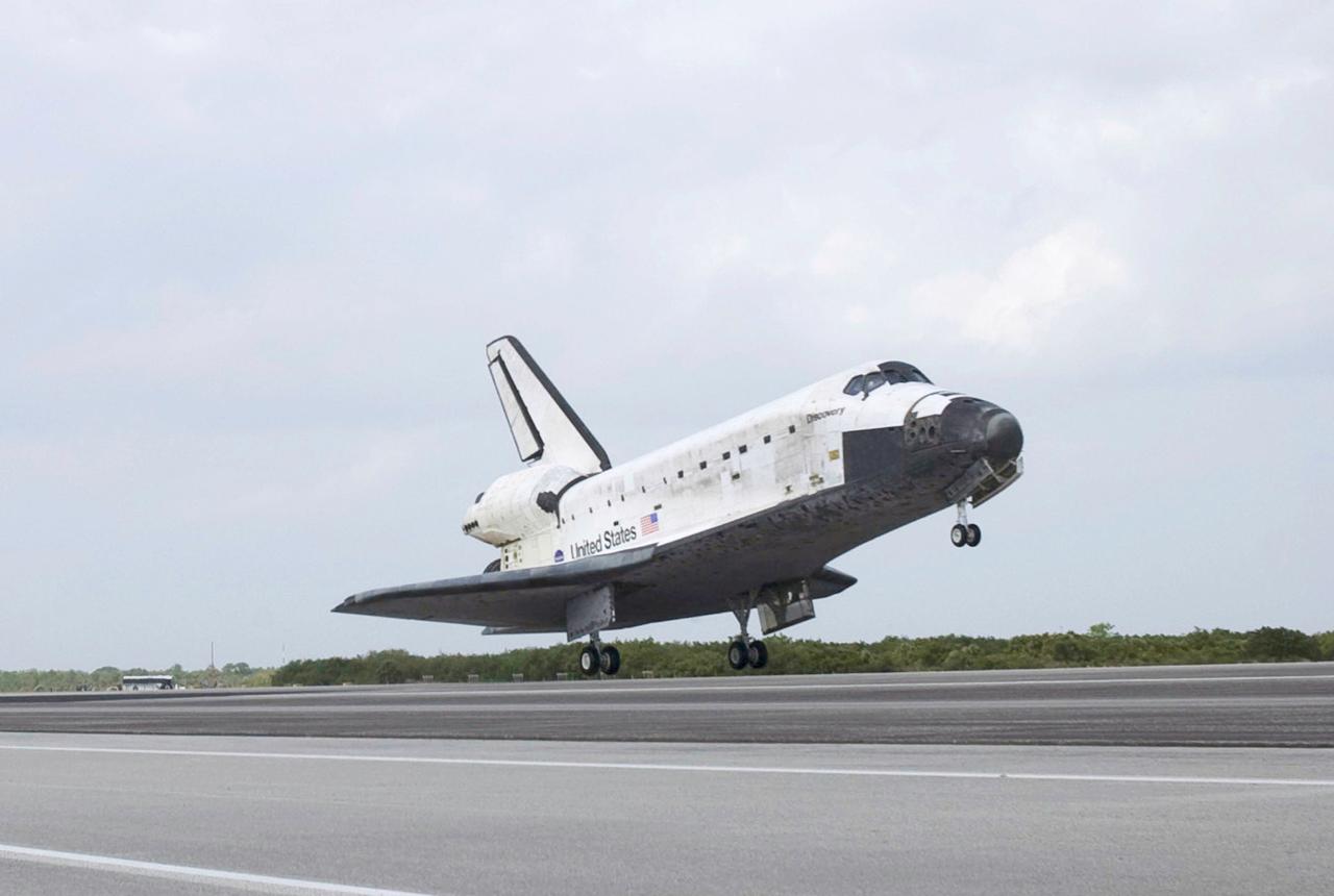 STS119-S-077 (28 March 2009) --- Space Shuttle Discovery approaches landing on Runway 15 of the Shuttle Landing Facility at NASA's Kennedy Space Center, concluding the 13-day, 5.3-million mile journey of the STS-119 mission to the International Space Station. Onboard are NASA astronauts Lee Archambault, commander; Tony Antonelli, pilot; Steve Swanson, Richard Arnold, Joseph Acaba, John Phillips and Sandra Magnus, all mission specialists. The main landing gear touched down at 3:13:17 p.m. (EDT) on March 28, 2009. The nose gear touched down at 3:13:40 p.m. and wheels stop was at 3:14:45 p.m. During the mission, Discovery?s crew delivered and installed the final pair of large power-generating solar array wings and the S6 truss segment to the starboard, or right, side of the station and accomplished important tasks to prepare the station for future upgrades and additions later this year.