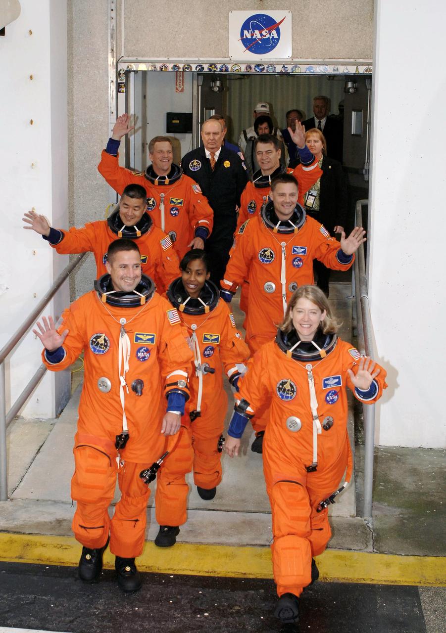 STS120-S-005 (23 Oct. 2007) --- After suiting up, the STS-120 crewmembers exit the Operations and Checkout Building to board the Astrovan, which will take them to launch pad 39A at Kennedy Space Center. On the right (front to back) are astronauts Pam Melroy, commander; Doug Wheelock and European Space Agency's (ESA) Paolo Nespoli, both mission specialists. On the left (front to back) are astronauts George Zamka, pilot; Stephanie Wilson, Daniel Tani and Scott Parazynski, all mission specialists. Discovery will link up with the International Space Station on Thursday, Oct. 25, to begin a joint mission to continue construction by delivering the Italian-built U.S. Node 2, called Harmony. During the 14-day mission, the crew will install Harmony and move the P6 solar arrays to their permanent position and deploy them.