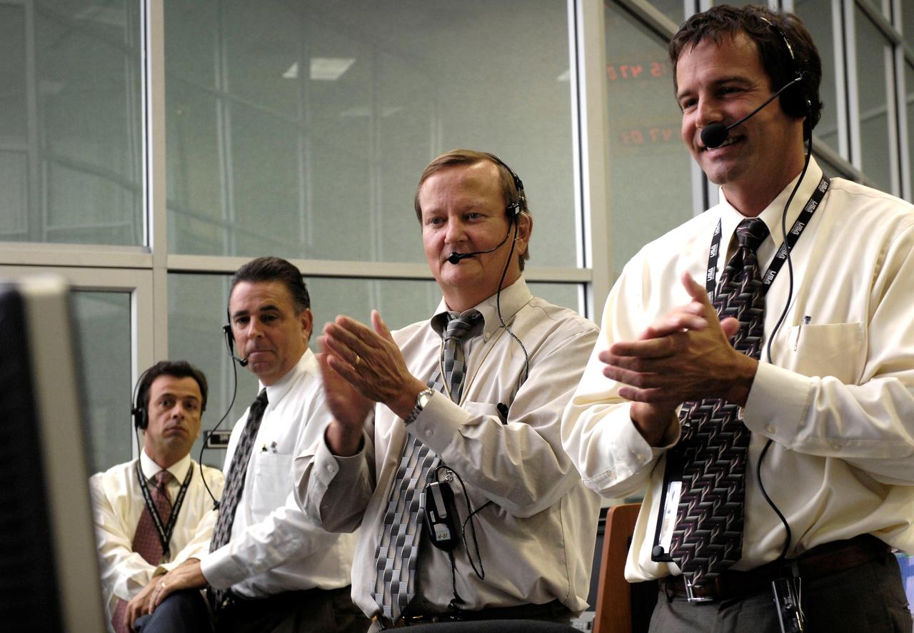 STS120-S-026 (23 Oct. 2007) --- In the firing room of the Kennedy Space Center in Florida, NASA Shuttle Launch Director Michael Leinbach (second right) and launch managers watch the 11:38 a.m. (EDT) launch of Space Shuttle Discovery.  Discovery launched Oct. 23 on a 14-day construction mission to the International Space Station. Photo credit: NASA/Bill Ingalls