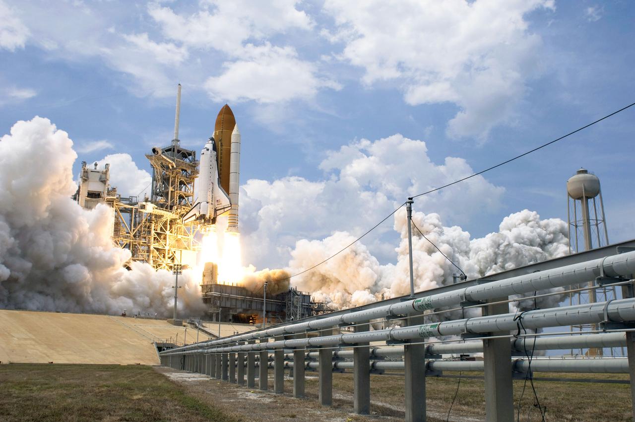 STS125-S-038 (11 May 2009) --- Space Shuttle Atlantis and its seven-member STS-125 crew head toward Earth orbit and rendezvous with NASA?s Hubble Space Telescope. Liftoff was on time at 2:01 p.m. (EDT) on May 11, 2009 from launch pad 39A at NASA's Kennedy Space Center. Onboard are astronauts Scott Altman, commander; Gregory C. Johnson, pilot; Michael Good, Megan McArthur, John Grunsfeld, Mike Massimino and Andrew Feustel, all mission specialists. Atlantis' 11-day flight will include five spacewalks to refurbish and upgrade the telescope with state-of-the-art science instruments that will expand Hubble's capabilities and extend its operational lifespan through at least 2014. The payload includes Wide Field Camera 3, fine guidance sensor and the Cosmic Origins Spectrograph.