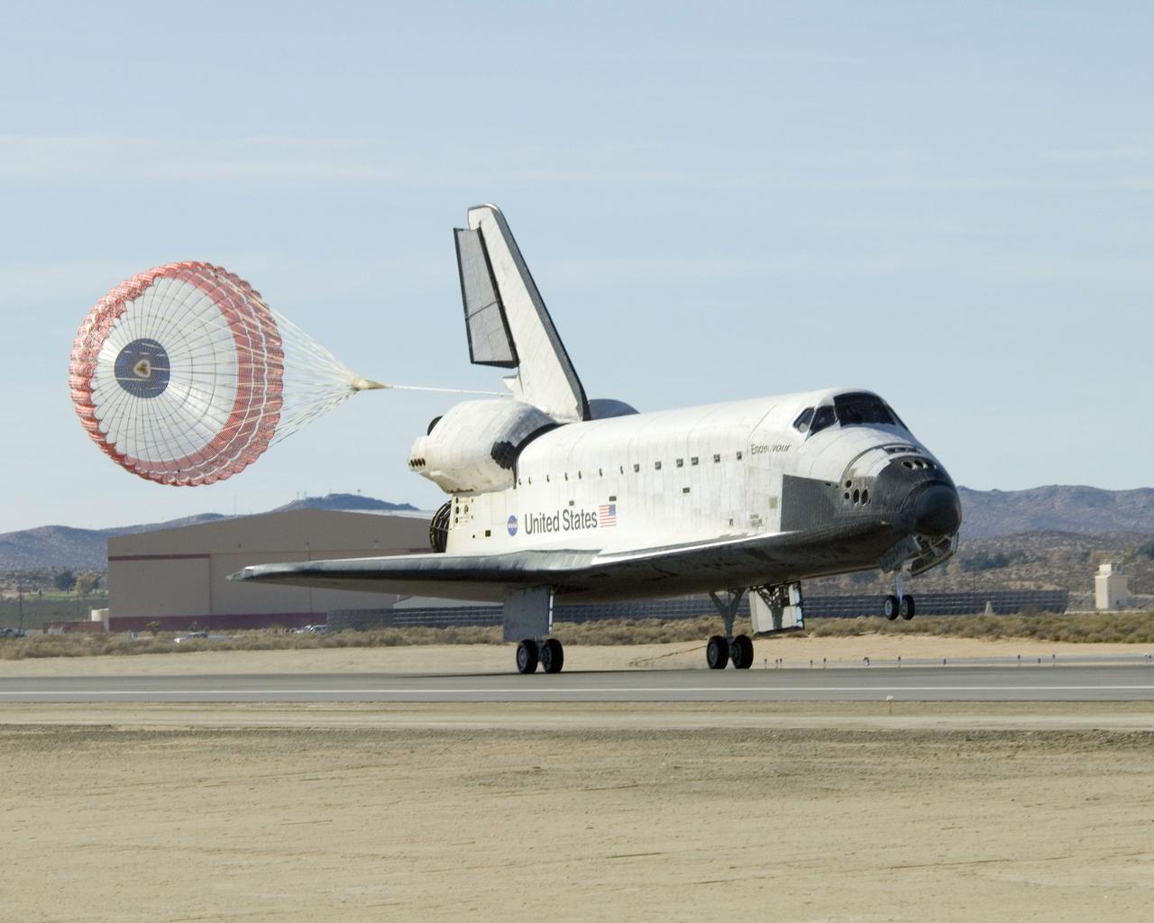 STS126-S-049 (30 Nov. 2008) --- With its drag chute deployed, Space Shuttle Endeavour slows to a stop after landing at NASA's Dryden Flight Research Center at Edwards Air Force Base in California, concluding a successful mission to the International Space Station. Endeavour landed at 1:25 p.m. (PST) on Nov. 30, 2008 to end the STS-126 mission, completing its 16-day journey of over 6.6 million miles in space. The landing was diverted to California due to marginal weather at the Kennedy Space Center. The main landing gear touched down at 1:25:06 p.m. (PST). The nose landing gear touched down at 1:25:21 p.m. and wheel stop was at 1:26:03 p.m. The STS-126 mission was the 27th flight to the International Space Station, carrying equipment and supplies in the Multi-Purpose Logistics Module Leonardo. The mission featured four spacewalks and work to prepare the space station to house six crewmembers for long-duration missions. Onboard were astronauts Chris Ferguson, commander; Eric Boe, pilot; Heidemarie Stefanyshyn-Piper, Donald Pettit, Steve Bowen, Shane Kimbrough and Greg Chamitoff, all mission specialists.