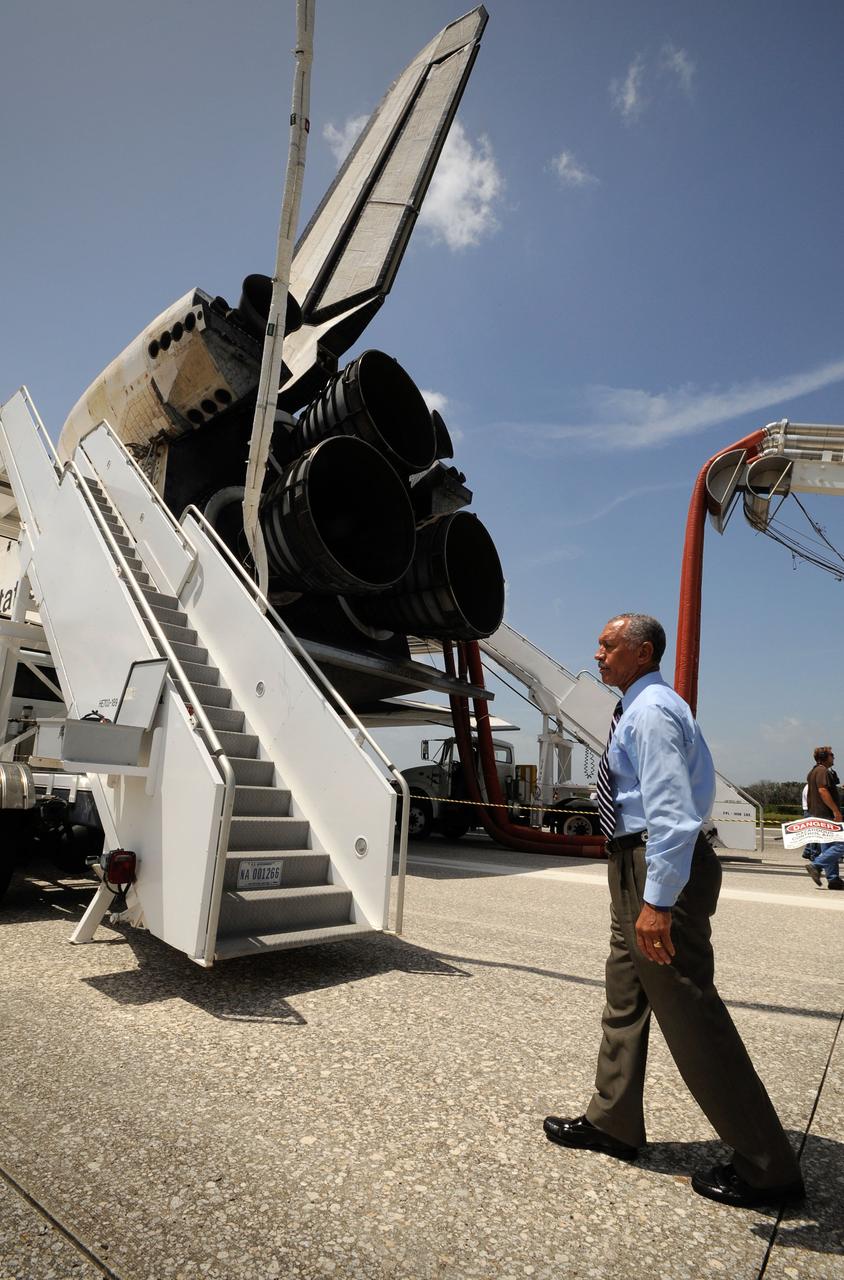 NASA Administrator Charles Bolden walks around the space shuttle Endeavour shortly after it and its crew landed, Friday, July 31, 2009 at NASA's Kennedy Space Center in Cape Canaveral, Florida, completing a 16-day journey of more than 6.5 million miles. Endeavour delivered the final segment to the Japan Aerospace Exploration Agency's Kibo laboratory and a new crew member to the International Space Station.