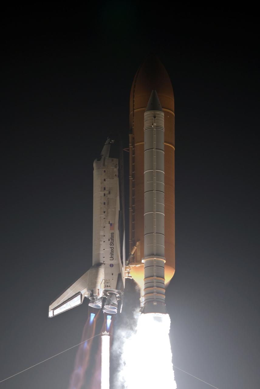 STS128-S-031 (28 Aug. 2009) --- Against a black night sky, Space Shuttle Discovery and its seven-member STS-128 crew head toward Earth orbit and rendezvous with the International Space Station (ISS). Liftoff was on time at 11:59 p.m. (EDT) on Aug. 28, 2009 from launch pad 39A at NASA?s Kennedy Space Center. Onboard are astronauts Rick Sturckow, commander; Kevin Ford, pilot; John ?Danny? Olivas, European Space Agency astronaut Christer Fuglesang, Patrick Forrester, Jose Hernandez and Nicole Stott, all mission specialists. Stott will join Expedition 20 in progress to serve as a flight engineer aboard the ISS. The 13-day mission will deliver more than seven tons of supplies, science racks and equipment, as well as additional environmental hardware to sustain six crew members on the space station. The equipment includes a freezer to store research samples, a new sleeping compartment and the COLBERT treadmill. The mission is the 128th in the Space Shuttle Program, the 37th flight of Discovery and the 30th station assembly flight.