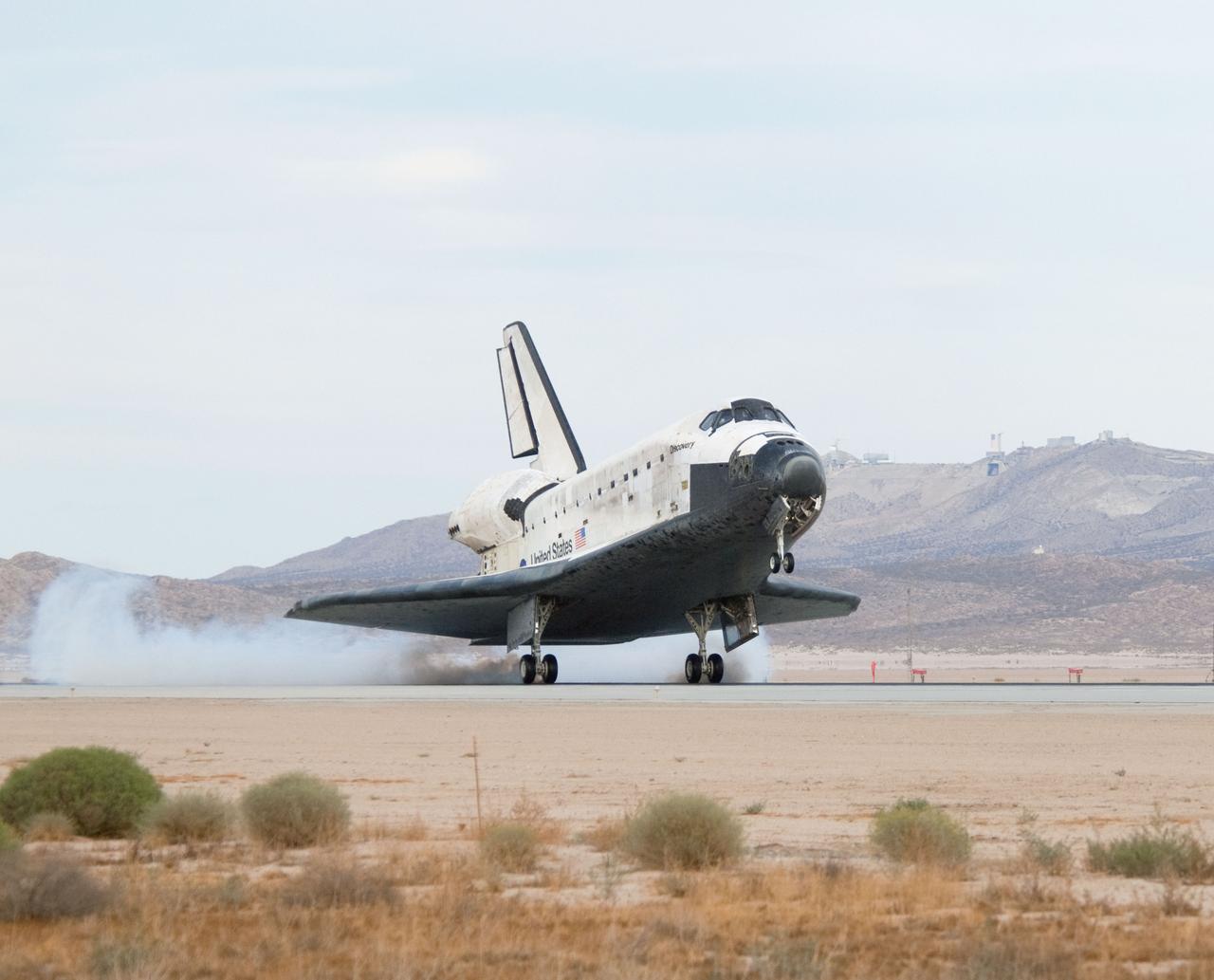 STS128-S-045 (11 Sept. 2009) --- Space Shuttle Discovery?s main landing gear touches down at NASA's Dryden Flight Research Center at Edwards Air Force Base in California, concluding a successful mission to the International Space Station. Onboard are NASA astronauts Rick Sturckow, commander; Kevin Ford, pilot; John ?Danny? Olivas, Patrick Forrester, Jose Hernandez and Tim Kopra, all mission specialists; along with European Space Agency astronaut Christer Fuglesang, mission specialist. Discovery landed at 5:53 p.m. (PDT) on Sept. 11, 2009 to end the STS-128 mission, completing its almost 14-day journey of more than 5.7 million miles in space. The landing was diverted to California due to marginal weather at the Kennedy Space Center. Discovery?s mission featured three spacewalks and the delivery of two refrigerator-sized science racks to the space station. One rack will be used to conduct experiments on materials such as metals, glasses and ceramics. The results from these experiments could lead to the development of better materials on Earth. The other rack will be used for fluid physics research. Understanding how fluids react in microgravity could lead to improved designs for fuel tanks, water systems and other fluid-based systems.