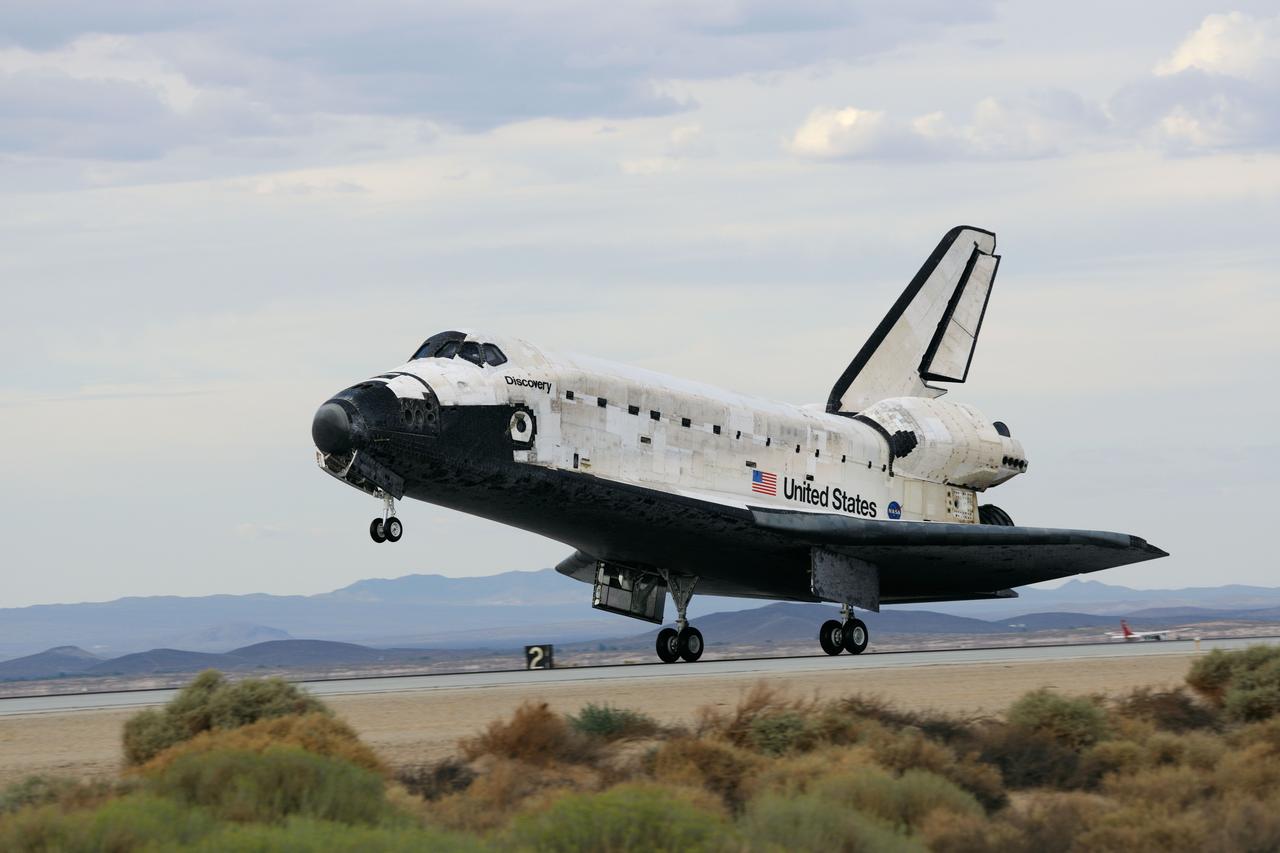 STS128-S-046 (11 Sept. 2009) --- Space Shuttle Discovery?s main landing gear touches down at NASA's Dryden Flight Research Center at Edwards Air Force Base in California, concluding a successful mission to the International Space Station. Onboard are NASA astronauts Rick Sturckow, commander; Kevin Ford, pilot; John ?Danny? Olivas, Patrick Forrester, Jose Hernandez and Tim Kopra, all mission specialists; along with European Space Agency astronaut Christer Fuglesang, mission specialist. Discovery landed at 5:53 p.m. (PDT) on Sept. 11, 2009 to end the STS-128 mission, completing its almost 14-day journey of more than 5.7 million miles in space. The landing was diverted to California due to marginal weather at the Kennedy Space Center. Discovery?s mission featured three spacewalks and the delivery of two refrigerator-sized science racks to the space station. One rack will be used to conduct experiments on materials such as metals, glasses and ceramics. The results from these experiments could lead to the development of better materials on Earth. The other rack will be used for fluid physics research. Understanding how fluids react in microgravity could lead to improved designs for fuel tanks, water systems and other fluid-based systems.