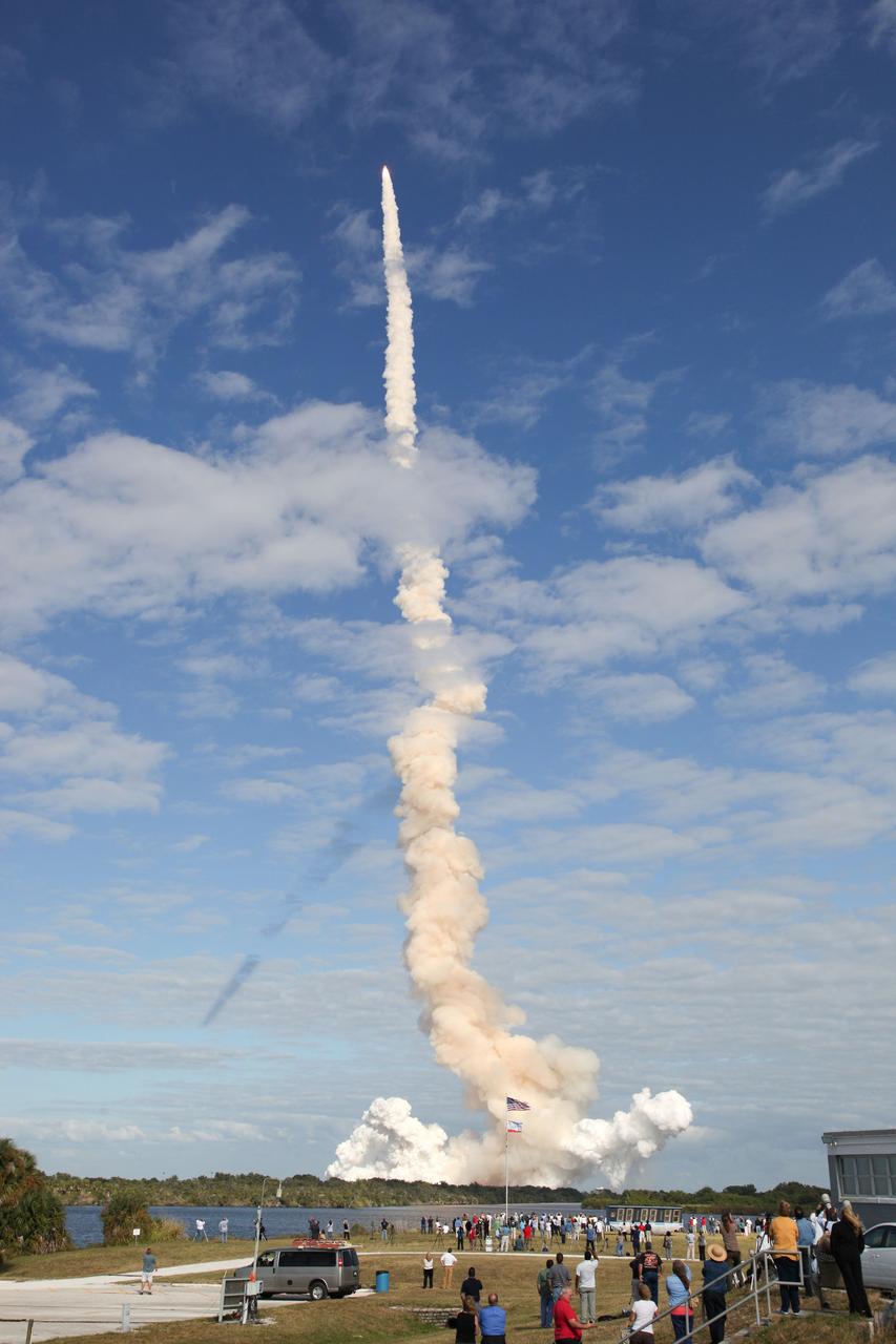 CAPE CANAVERAL, Fla. - Twitter followers and media representatives at the NASA Press Site witness space shuttle Atlantis cut its way through the blue skies over Launch Pad 39A at NASA's Kennedy Space Center in Florida. Liftoff on its STS-129 mission came at 2:28 p.m. EST Nov. 16. Aboard are crew members Commander Charles O. Hobaugh; Pilot Barry E. Wilmore; and Mission Specialists Leland Melvin, Randy Bresnik, Mike Foreman and Robert L. Satcher Jr. On STS-129, the crew will deliver two Express Logistics Carriers to the International Space Station, the largest of the shuttle's cargo carriers, containing 15 spare pieces of equipment including two gyroscopes, two nitrogen tank assemblies, two pump modules, an ammonia tank assembly and a spare latching end effector for the station's robotic arm. Atlantis will return to Earth a station crew member, Nicole Stott, who has spent more than two months aboard the orbiting laboratory. STS-129 is slated to be the final space shuttle Expedition crew rotation flight. For information on the STS-129 mission and crew, visit http://www.nasa.gov/mission_pages/shuttle/shuttlemissions/sts129/index.html. Photo credit: NASA/Gianni Woods