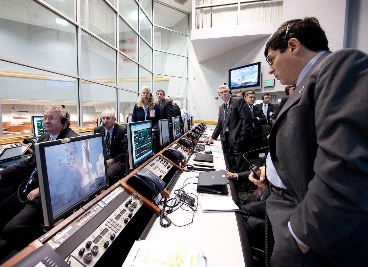 NASA Associate Administrator Chris Scolese monitors the launch of the space shuttle Atlantis from firing room four of the NASA Kennedy Space Center, Monday, Nov. 16, 2009, Cape Canaveral, FL.  Space shuttle Atlantis and its six-member crew began the 11-day STS-129 mission to the International Space Station. The shuttle will transport spare hardware to the outpost and return a station crew member who spent more than two months in space.  Photo Credit: (NASA/Bill Ingalls)