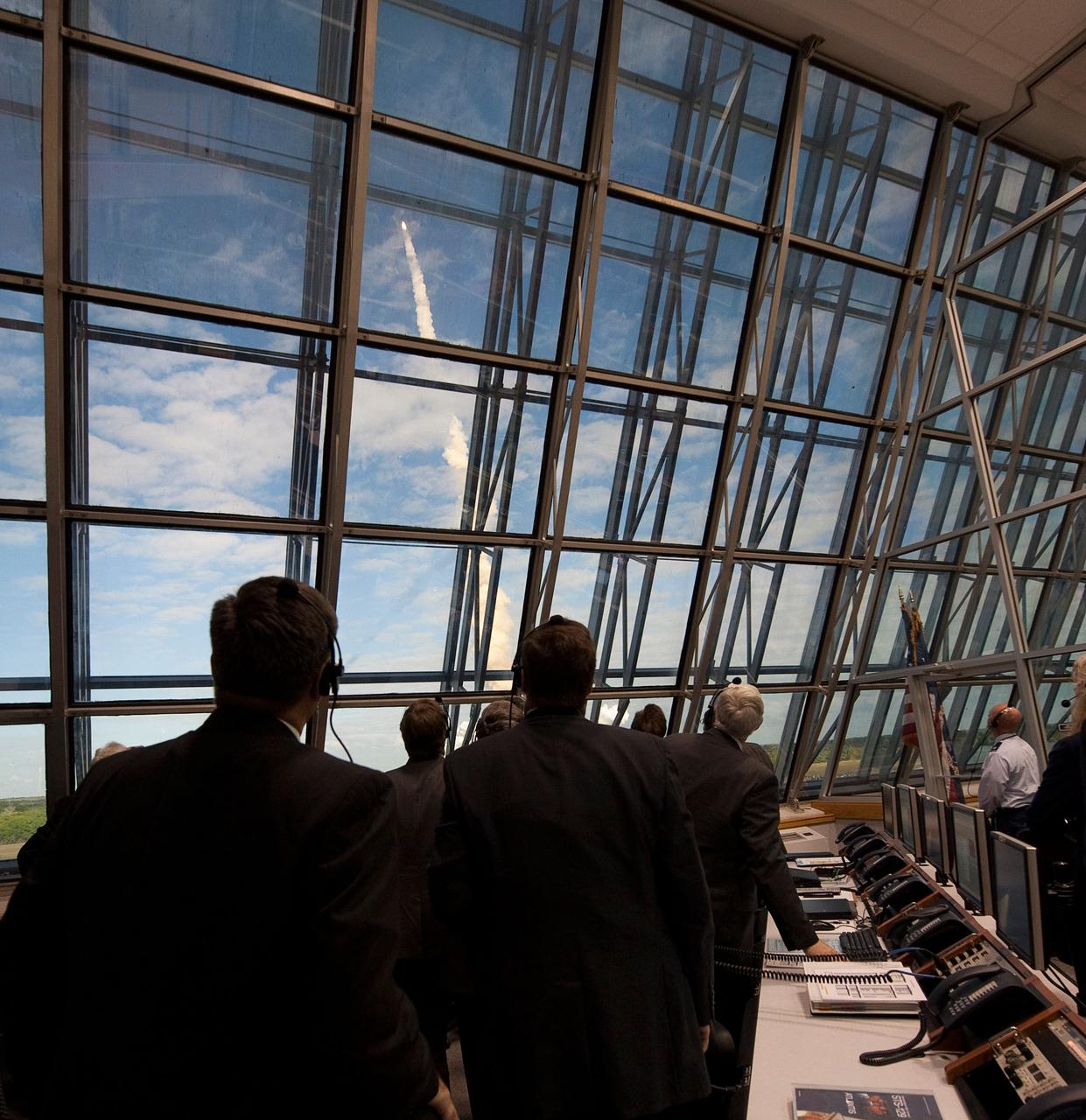 NASA mission managers monitor the launch of the space shuttle Atlantis from firing room four of the NASA Kennedy Space Center, Monday, Nov. 16, 2009, Cape Canaveral, FL.  Space shuttle Atlantis and its six-member crew began the 11-day STS-129 mission to the International Space Station. The shuttle will transport spare hardware to the outpost and return a station crew member who spent more than two months in space.  Photo Credit: (NASA/Bill Ingalls)