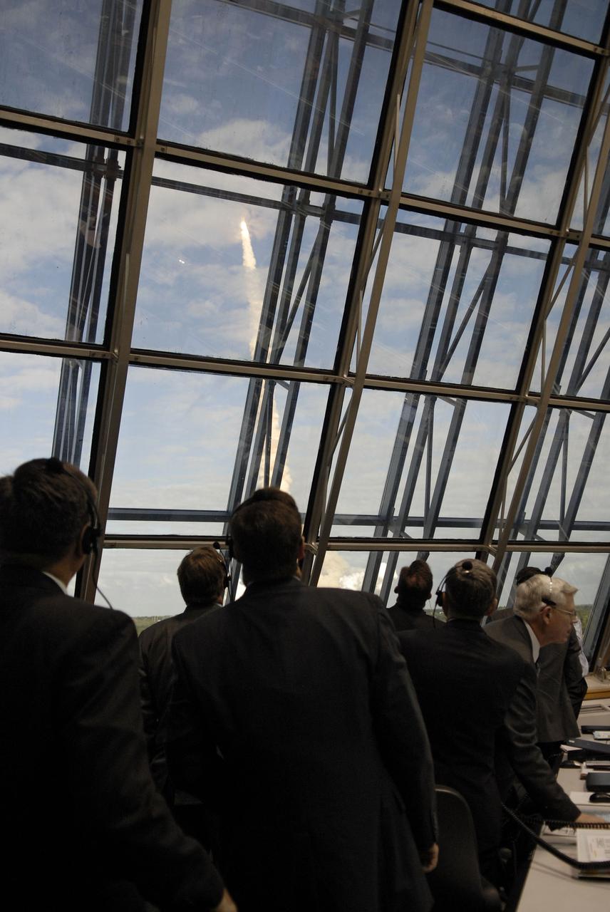 STS129-S-056 (16 Nov. 2009) --- Members of the space shuttle launch team watch Space Shuttle Atlantis' launch through the newly installed windows of Firing Room 4 in the Launch Control Center at NASA's Kennedy Space Center in Florida. Liftoff of Atlantis from Launch Pad 39A on its STS-129 mission to the International Space Station came at 2:28 p.m. (EST) Nov. 16, 2009.