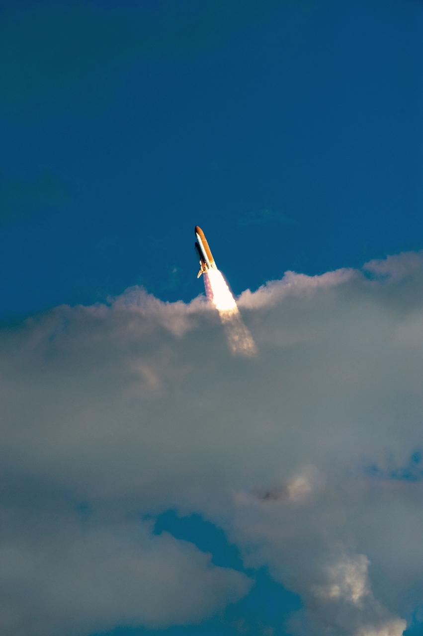 STS129-S-066 (16 Nov. 2009) --- Space Shuttle Atlantis and its six-member STS-129 crew head toward Earth orbit and rendezvous with the International Space Station. Liftoff was on time at 2:28 p.m. (EST) on Nov. 16, 2009 from launch pad 39A at NASA?s Kennedy Space Center, Florida. Onboard are astronauts Charles O. Hobaugh, commander; Barry E. Wilmore, pilot; along with Leland Melvin, Mike Foreman, Robert L. Satcher Jr. and Randy Bresnik, all mission specialists. Atlantis will deliver two Express Logistics Carriers to the station, the largest of the shuttle's cargo carriers, containing 15 spare pieces of equipment including two gyroscopes, two nitrogen tank assemblies, two pump modules, an ammonia tank assembly and a spare latching end effector for the station's robotic arm. Atlantis will return to Earth a station crew member, Nicole Stott, who has spent more than two months aboard the orbiting laboratory. STS-129 is slated to be the final space shuttle Expedition crew rotation flight.