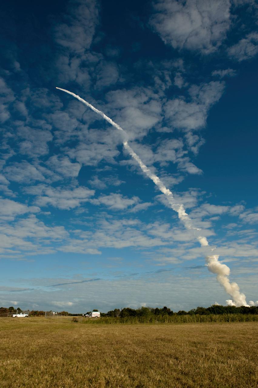 STS129-S-067 (16 Nov. 2009) --- Space Shuttle Atlantis and its six-member STS-129 crew head toward Earth orbit and rendezvous with the International Space Station. Liftoff was on time at 2:28 p.m. (EST) on Nov. 16, 2009 from launch pad 39A at NASA?s Kennedy Space Center, Florida. Onboard are astronauts Charles O. Hobaugh, commander; Barry E. Wilmore, pilot; along with Leland Melvin, Mike Foreman, Robert L. Satcher Jr. and Randy Bresnik, all mission specialists. Atlantis will deliver two Express Logistics Carriers to the station, the largest of the shuttle's cargo carriers, containing 15 spare pieces of equipment including two gyroscopes, two nitrogen tank assemblies, two pump modules, an ammonia tank assembly and a spare latching end effector for the station's robotic arm. Atlantis will return to Earth a station crew member, Nicole Stott, who has spent more than two months aboard the orbiting laboratory. STS-129 is slated to be the final space shuttle Expedition crew rotation flight.