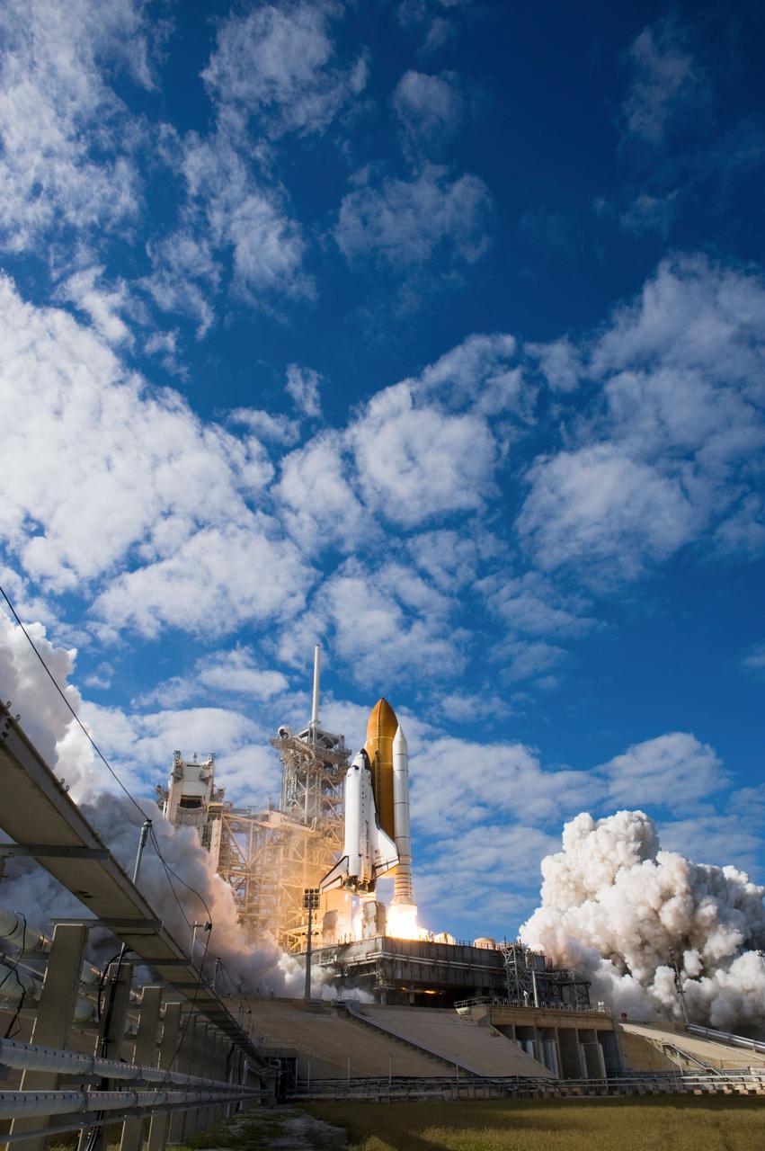 STS129-S-086 (16 Nov. 2009) --- Space Shuttle Atlantis and its six-member STS-129 crew head toward Earth orbit and rendezvous with the International Space Station. Liftoff was on time at 2:28 p.m. (EST) on Nov. 16, 2009 from launch pad 39A at NASA?s Kennedy Space Center, Florida. Onboard are astronauts Charles O. Hobaugh, commander; Barry E. Wilmore, pilot; along with Leland Melvin, Mike Foreman, Robert L. Satcher Jr. and Randy Bresnik, all mission specialists. Atlantis will deliver two Express Logistics Carriers to the station, the largest of the shuttle's cargo carriers, containing 15 spare pieces of equipment including two gyroscopes, two nitrogen tank assemblies, two pump modules, an ammonia tank assembly and a spare latching end effector for the station's robotic arm. Atlantis will return to Earth a station crew member, Nicole Stott, who has spent more than two months aboard the orbiting laboratory. STS-129 is slated to be the final space shuttle Expedition crew rotation flight.