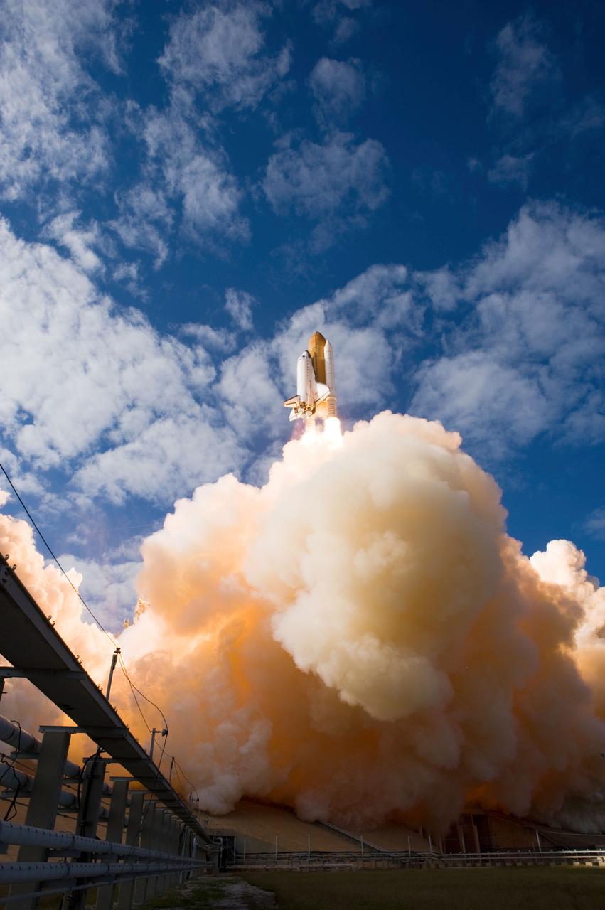 STS129-S-088 (16 Nov. 2009) --- Space Shuttle Atlantis and its six-member STS-129 crew head toward Earth orbit and rendezvous with the International Space Station. Liftoff was on time at 2:28 p.m. (EST) on Nov. 16, 2009 from launch pad 39A at NASA?s Kennedy Space Center, Florida. Onboard are astronauts Charles O. Hobaugh, commander; Barry E. Wilmore, pilot; along with Leland Melvin, Mike Foreman, Robert L. Satcher Jr. and Randy Bresnik, all mission specialists. Atlantis will deliver two Express Logistics Carriers to the station, the largest of the shuttle's cargo carriers, containing 15 spare pieces of equipment including two gyroscopes, two nitrogen tank assemblies, two pump modules, an ammonia tank assembly and a spare latching end effector for the station's robotic arm. Atlantis will return to Earth a station crew member, Nicole Stott, who has spent more than two months aboard the orbiting laboratory. STS-129 is slated to be the final space shuttle Expedition crew rotation flight.