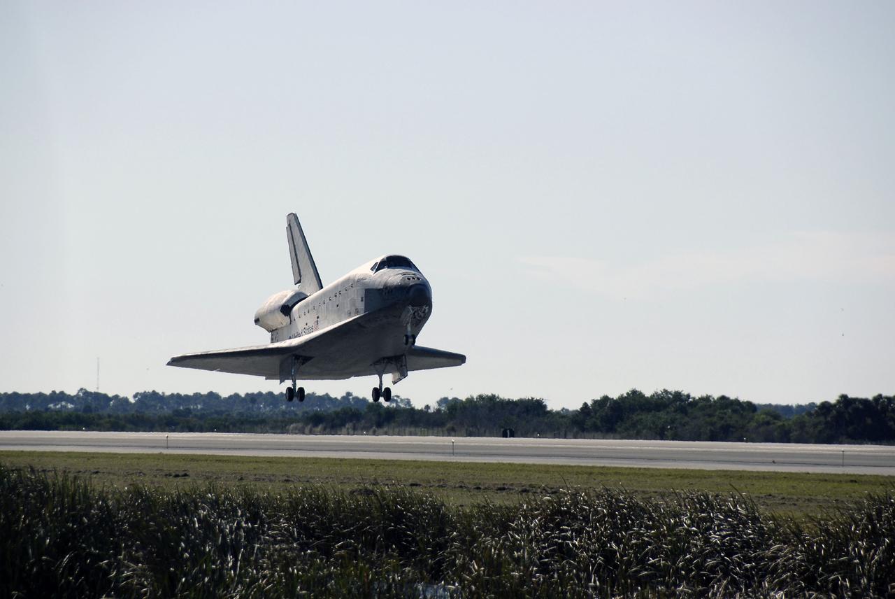 PHOTO CREDIT: NASA or National Aeronautics and Space Administration CAPE CANAVERAL, Fla. - With landing gear down, space shuttle Atlantis approaches landing on Runway 33 at the Shuttle Landing Facility at NASA's Kennedy Space Center in Florida after 11 days in space, completing the 4.5-million mile STS-129 mission on orbit 171. Main gear touchdown was at 9:44:23 a.m. EDT. Nose gear touchdown was at 9:44:36 a.m., and wheels stop was at 9:45:05 a.m. Aboard Atlantis are Commander Charles O. Hobaugh; Pilot Barry E. Wilmore; Mission Specialists Leland Melvin, Randy Bresnik, Mike Foreman and Robert L. Satcher Jr.; and Expedition 20 and 21 Flight Engineer Nicole Stott who spent 87 days aboard the International Space Station. STS-129 is the final space shuttle Expedition crew rotation flight on the manifest. On STS-129, the crew delivered 14 tons of cargo to the orbiting laboratory, including two ExPRESS Logistics Carriers containing spare parts to sustain station operations after the shuttles are retired next year. For information on the STS-129 mission and crew, visit http://www.nasa.gov/mission_pages/shuttle/shuttlemissions/sts129/index.html. Photo credit: NASA/Kim Shiflett