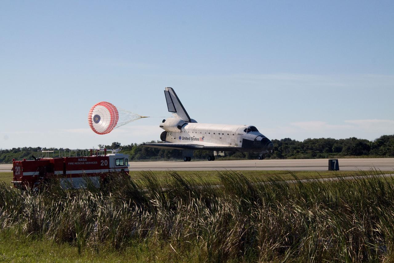 PHOTO CREDIT: NASA or National Aeronautics and Space Administration CAPE CANAVERAL, Fla. - A fire and rescue truck is in place beside Runway 33 if needed to support the landing of space shuttle Atlantis at the Shuttle Landing Facility at NASA's Kennedy Space Center in Florida. After 11 days in space, Atlantis completed the 4.5-million mile STS-129 mission on orbit 171. Main gear touchdown was at 9:44:23 a.m. EDT. Nose gear touchdown was at 9:44:36 a.m., and wheels stop was at 9:45:05 a.m. Aboard Atlantis are Commander Charles O. Hobaugh; Pilot Barry E. Wilmore; Mission Specialists Leland Melvin, Randy Bresnik, Mike Foreman and Robert L. Satcher Jr.; and Expedition 20 and 21 Flight Engineer Nicole Stott who spent 87 days aboard the International Space Station. STS-129 is the final space shuttle Expedition crew rotation flight on the manifest. On STS-129, the crew delivered 14 tons of cargo to the orbiting laboratory, including two ExPRESS Logistics Carriers containing spare parts to sustain station operations after the shuttles are retired next year. For information on the STS-129 mission and crew, visit http://www.nasa.gov/mission_pages/shuttle/shuttlemissions/sts129/index.html. Photo credit: NASA/Jack Pfaller