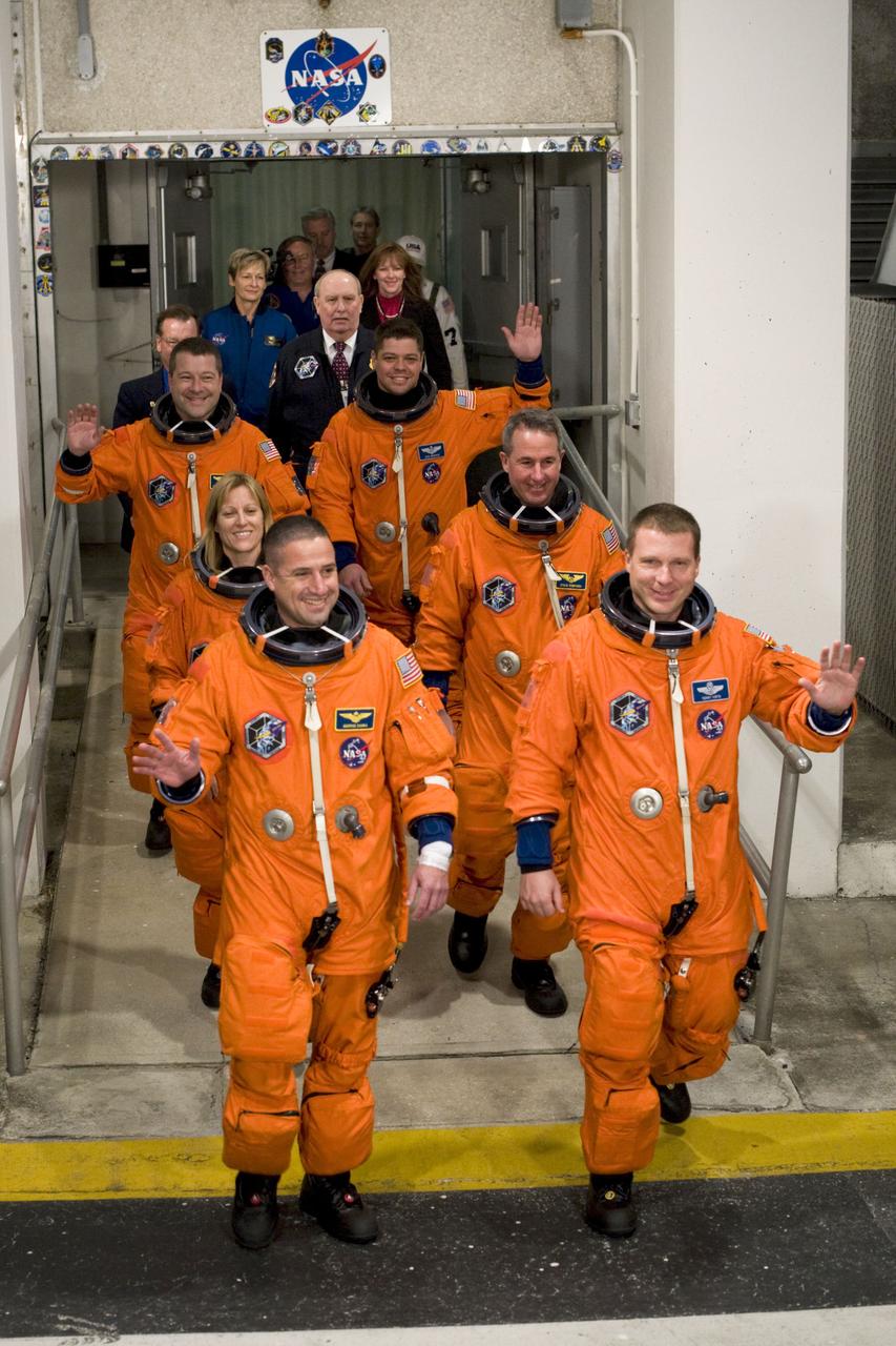 STS130-S-014 (8 Feb. 2010) --- After suiting up, the STS-130 crew members exit the Operations and Checkout Building to board the Astrovan, which will take them to launch pad 39A for the launch of space shuttle Endeavour on the STS-130 mission. On the left (front to back) are NASA astronauts George Zamka, commander; Kathryn Hire and Nicholas Patrick, both mission specialists. On the right (front to back) are NASA astronauts Terry Virts, pilot; Stephen Robinson and Robert Behnken, both mission specialists. This is the second launch attempt for Endeavour's STS-130 crew. The first attempt on Feb. 7 was scrubbed due to unfavorable weather. The primary payload for the STS-130 mission to the International Space Station is the Tranquility node, a pressurized module that will provide additional room for crew members and many of the station's life support and environmental control systems. Attached to one end of Tranquility is the Cupola module, a unique work area with six windows on its sides and one on top. The Cupola resembles a circular bay window and will provide a vastly improved view of the station's exterior. The multi-directional view will allow the crew to monitor spacewalks and docking operations, as well as provide a spectacular view of Earth and other celestial objects. The module was built in Turin, Italy, by Thales Alenia Space for the European Space Agency. Endeavour's launch is set for Feb. 8, 2010, at 4:14 a.m. (EST).