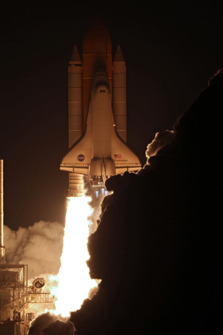STS130-S-050 (8 Feb. 2010) --- Against a black night sky, space shuttle Endeavour and its six-member STS-130 crew head toward Earth orbit and rendezvous with the International Space Station. Liftoff was at 4:14 a.m. (EST) on Feb. 8, 2010 from launch pad 39A at NASA's Kennedy Space Center. Onboard are NASA astronauts George Zamka, commander; Terry Virts, pilot; Robert Behnken, Kathryn Hire, Nicholas Patrick and Stephen Robinson, all mission specialists. This was the second launch attempt for Endeavour's STS-130 crew and the final scheduled space shuttle night launch. The first attempt on Feb. 7 was scrubbed due to unfavorable weather. The primary payload for the STS-130 mission to the International Space Station is the Tranquility node, a pressurized module that will provide additional room for crew members and many of the station's life support and environmental control systems. Attached to one end of Tranquility is the Cupola module, a unique work area with six windows on its sides and one on top. The Cupola resembles a circular bay window and will provide a vastly improved view of the station's exterior. The multi-directional view will allow the crew to monitor spacewalks and docking operations, as well as provide a spectacular view of Earth and other celestial objects. The module was built in Turin, Italy, by Thales Alenia Space for the European Space Agency.
