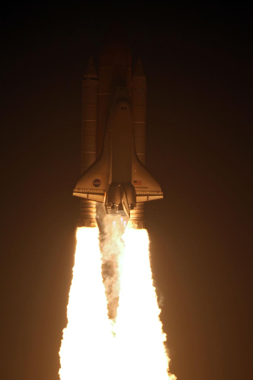 STS130-S-051 (8 Feb. 2010) --- Against a black night sky, space shuttle Endeavour and its six-member STS-130 crew head toward Earth orbit and rendezvous with the International Space Station. Liftoff was at 4:14 a.m. (EST) on Feb. 8, 2010 from launch pad 39A at NASA's Kennedy Space Center. Onboard are NASA astronauts George Zamka, commander; Terry Virts, pilot; Robert Behnken, Kathryn Hire, Nicholas Patrick and Stephen Robinson, all mission specialists. This was the second launch attempt for Endeavour's STS-130 crew and the final scheduled space shuttle night launch. The first attempt on Feb. 7 was scrubbed due to unfavorable weather. The primary payload for the STS-130 mission to the International Space Station is the Tranquility node, a pressurized module that will provide additional room for crew members and many of the station's life support and environmental control systems. Attached to one end of Tranquility is the Cupola module, a unique work area with six windows on its sides and one on top. The Cupola resembles a circular bay window and will provide a vastly improved view of the station's exterior. The multi-directional view will allow the crew to monitor spacewalks and docking operations, as well as provide a spectacular view of Earth and other celestial objects. The module was built in Turin, Italy, by Thales Alenia Space for the European Space Agency.