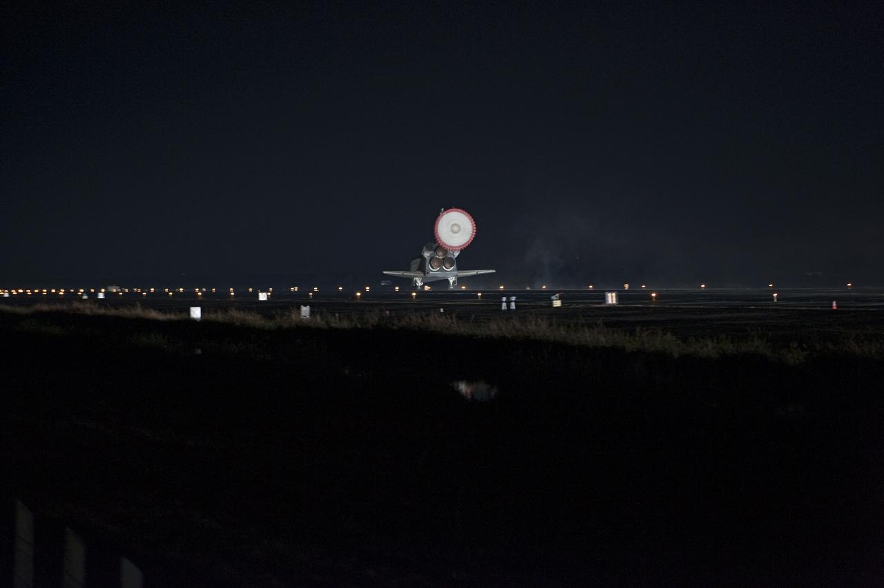 STS130-S-085 (21 Feb. 2010) --- Space shuttle Endeavour?s drag chute is deployed as the spacecraft rolls toward wheels stop on landing Runway 15 at the Shuttle Landing Facility at NASA's Kennedy Space Center in Florida after 14 days in space, completing the 5.7-million-mile STS-130 mission to the International Space Station on orbit 217. Main gear touchdown was at 10:20:31 p.m. (EST) on Feb. 21, 2010; followed by nose gear touchdown at 10:20:39 p.m. and wheels stop at 10:22:10 p.m. It was the 23rd night landing in shuttle history and the 17th at Kennedy. Aboard are NASA astronauts George Zamka, commander; Terry Virts, pilot; Robert Behnken, Nicholas Patrick, Kathryn Hire and Stephen Robinson, all mission specialists. During Endeavour's STS-130 mission, astronauts installed the Tranquility node, a module that provides additional room for crew members and many of the station's life support and environmental control systems. Attached to Tranquility is a Cupola with seven windows that provide a panoramic view of Earth, celestial objects and visiting spacecraft. The module was built in Turin, Italy, by Thales Alenia Space for the European Space Agency. The orbiting laboratory is approximately 90 percent complete now in terms of mass. STS-130 was the 24th flight for Endeavour, the 32nd shuttle mission devoted to ISS assembly and maintenance, and the 130th shuttle mission to date.
