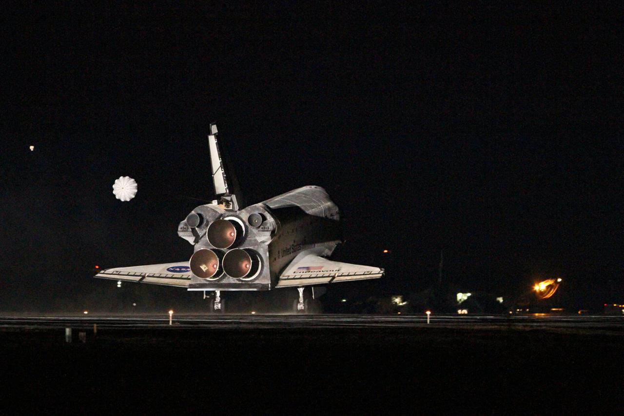 STS130-S-128 (21 Feb. 2010) --- Space shuttle Endeavour?s drag chute is deployed as the spacecraft rolls toward wheels stop on landing Runway 15 at the Shuttle Landing Facility at NASA's Kennedy Space Center in Florida after 14 days in space, completing the 5.7-million-mile STS-130 mission to the International Space Station on orbit 217. Main gear touchdown was at 10:20:31 p.m. (EST) on Feb. 21, 2010; followed by nose gear touchdown at 10:20:39 p.m. and wheels stop at 10:22:10 p.m. It was the 23rd night landing in shuttle history and the 17th at Kennedy. Aboard are NASA astronauts George Zamka, commander; Terry Virts, pilot; Robert Behnken, Nicholas Patrick, Kathryn Hire and Stephen Robinson, all mission specialists. During Endeavour's STS-130 mission, astronauts installed the Tranquility node, a module that provides additional room for crew members and many of the station's life support and environmental control systems. Attached to Tranquility is a Cupola with seven windows that provide a panoramic view of Earth, celestial objects and visiting spacecraft. The module was built in Turin, Italy, by Thales Alenia Space for the European Space Agency. The orbiting laboratory is approximately 90 percent complete now in terms of mass. STS-130 was the 24th flight for Endeavour, the 32nd shuttle mission devoted to ISS assembly and maintenance, and the 130th shuttle mission to date.