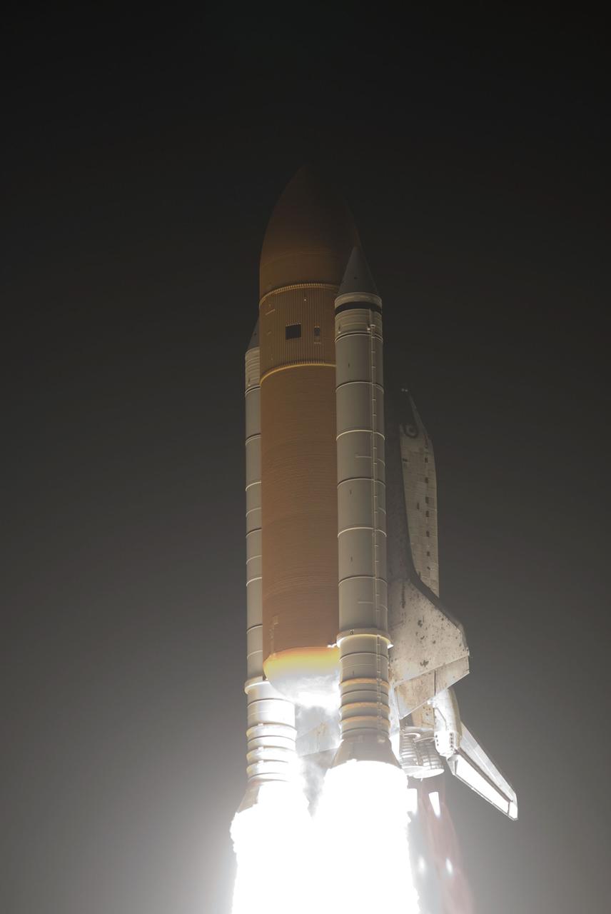STS131-S-049 (5 April 2010) --- Space shuttle Discovery and its seven-member STS-131 crew head toward Earth orbit and rendezvous with the International Space Station. Liftoff was at 6:21 a.m. (EDT) on April 5, 2010, from launch pad 39A at NASA's Kennedy Space Center. Onboard are NASA astronauts Alan Poindexter, commander; James P. Dutton Jr., pilot; Rick Mastracchio, Dorothy Metcalf-Lindenburger, Stephanie Wilson and Clayton Anderson; along with Japan Aerospace Exploration Agency (JAXA) astronaut Naoko Yamazaki, all mission specialists. The crew will deliver the multi-purpose logistics module Leonardo, filled with supplies, a new crew sleeping quarters and science racks that will be transferred to the International Space Station's laboratories. The crew also will switch out a gyroscope on the station’s truss structure, install a spare ammonia storage tank and retrieve a Japanese experiment from the station’s exterior. STS-131 is the 33rd shuttle mission to the station and the 131st shuttle mission overall.