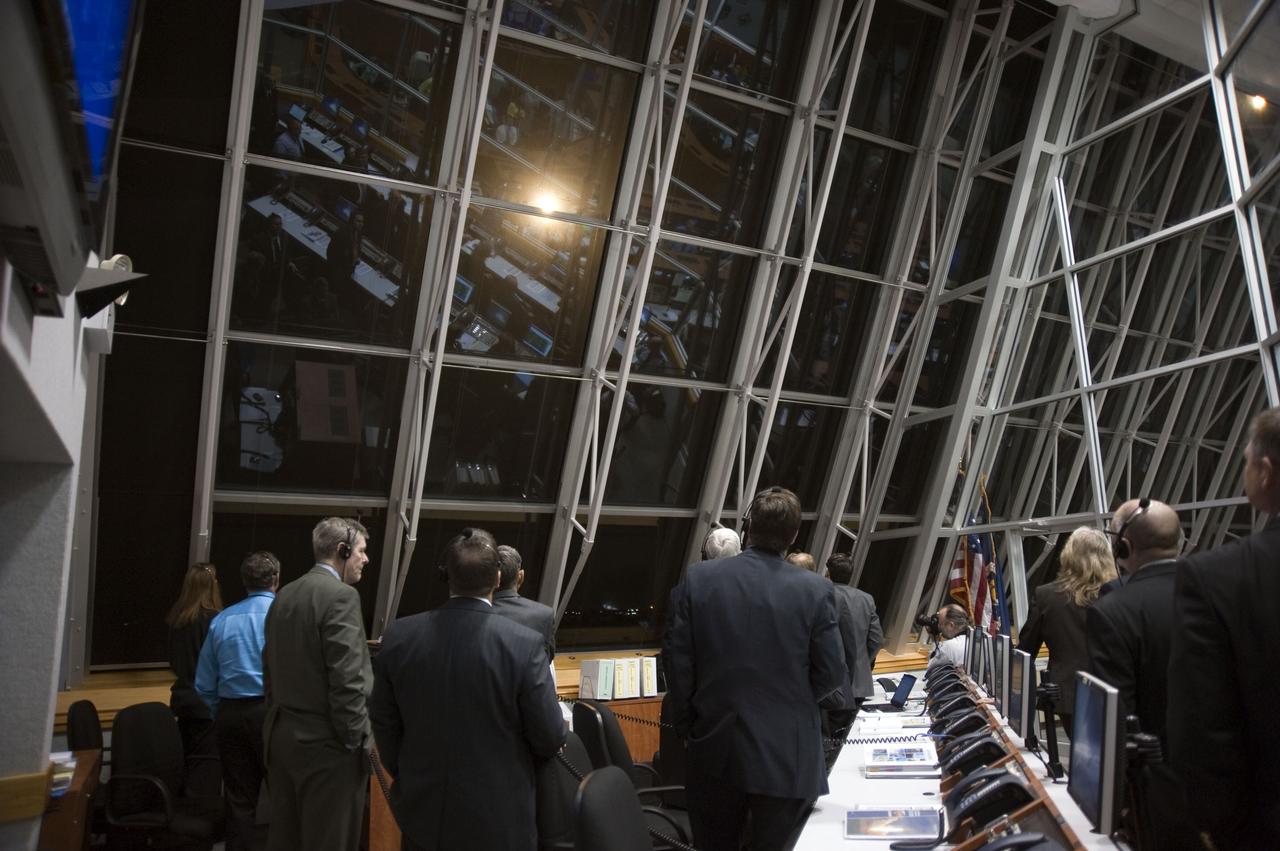 STS131-S-056 (5 April 2010) --- NASA officials watch the liftoff of space shuttle Discovery through the windows of Firing Room 4 in the Launch Control Center at NASA's Kennedy Space Center in Florida. Discovery lifted off at 6:21 a.m. (EDT) on April 5, 2010. The seven-member STS-131 crew will deliver the multi-purpose logistics module Leonardo, filled with supplies, a new crew sleeping quarters and science racks that will be transferred to the International Space Station's laboratories. The crew also will switch out a gyroscope on the station’s truss structure, install a spare ammonia storage tank and retrieve a Japanese experiment from the station’s exterior. STS-131 is the 33rd shuttle mission to the station and the 131st shuttle mission overall.