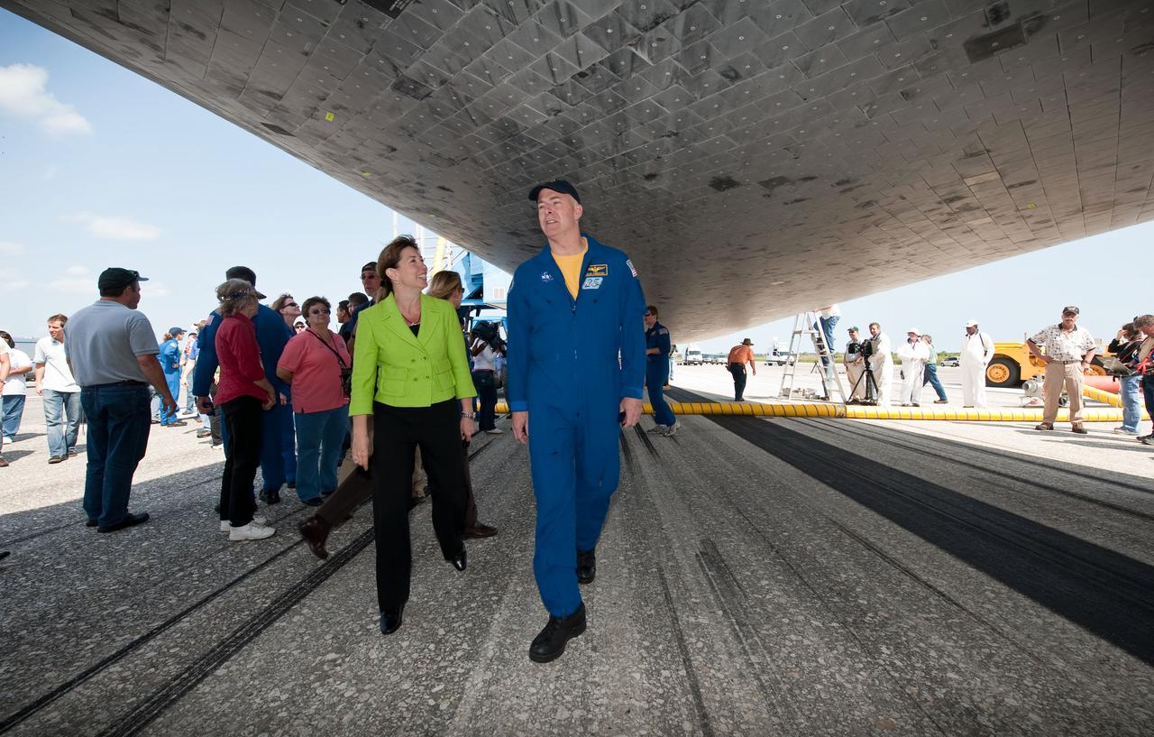 STS131-S-091 (20 April 2010) --- NASA Deputy Administrator Lori Garver and NASA astronaut Alan Poindexter, STS-131 commander, walk around under the space shuttle Discovery shortly after Discovery and its seven-member crew landed at the Kennedy Space Center in Cape Canaveral, Fla., on April 20, 2010. Poindexter and NASA astronaut James P. Dutton Jr., pilot; along with NASA astronauts Dorothy Metcalf-Lindenburger, Rick Mastracchio, Stephanie Wilson, Clayton Anderson and Japanese astronaut Naoko Yamazaki, all mission specialists, returned from their 15-day journey of more than 6.2 million miles. The STS-131 mission to the International Space Station delivered science racks, new crew sleeping quarters, equipment and supplies. Photo credit: NASA/Bill Ingalls