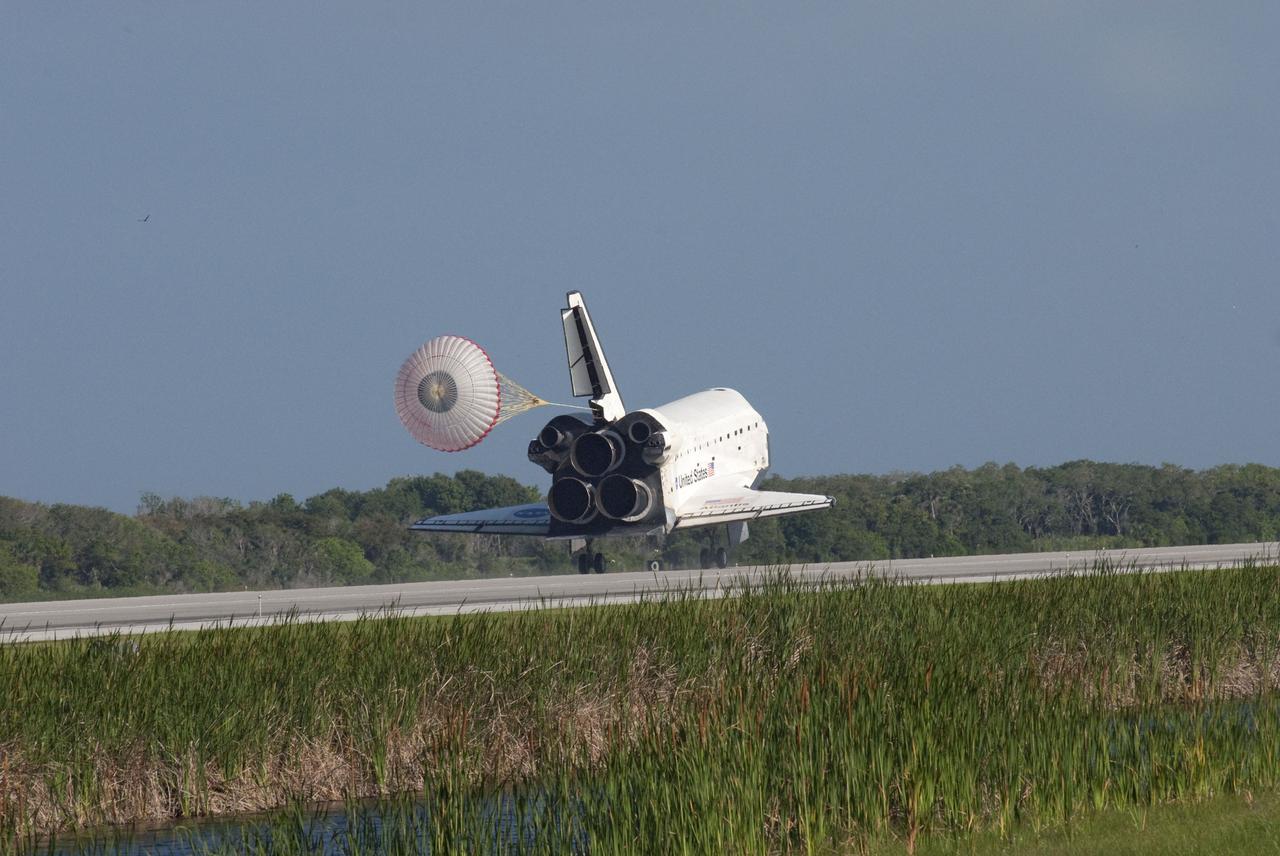 STS132-S-091 (26 May 2010) --- Space shuttle Atlantis? drag chute is deployed as the spacecraft rolls toward wheels stop on Runway 33 at the Shuttle Landing Facility at NASA's Kennedy Space Center in Florida. Landing was at 8:48 a.m. (EDT) on May 26, 2010, completing the 12-day STS-132 mission to the International Space Station. Main gear touchdown was at 8:48:11 a.m., followed by nose gear touchdown at 8:48:21 a.m. and wheelstop at 8:49:18 a.m. Onboard are NASA astronauts Ken Ham, commander; Tony Antonelli, pilot; Garrett Reisman, Michael Good, Steve Bowen and Piers Sellers, all mission specialists. The six-member STS-132 crew carried the Russian-built Mini Research Module 1 (MRM1) to the orbital complex. STS-132 is the 34th shuttle mission to the station, the 132nd shuttle mission overall and the last planned flight for Atlantis.