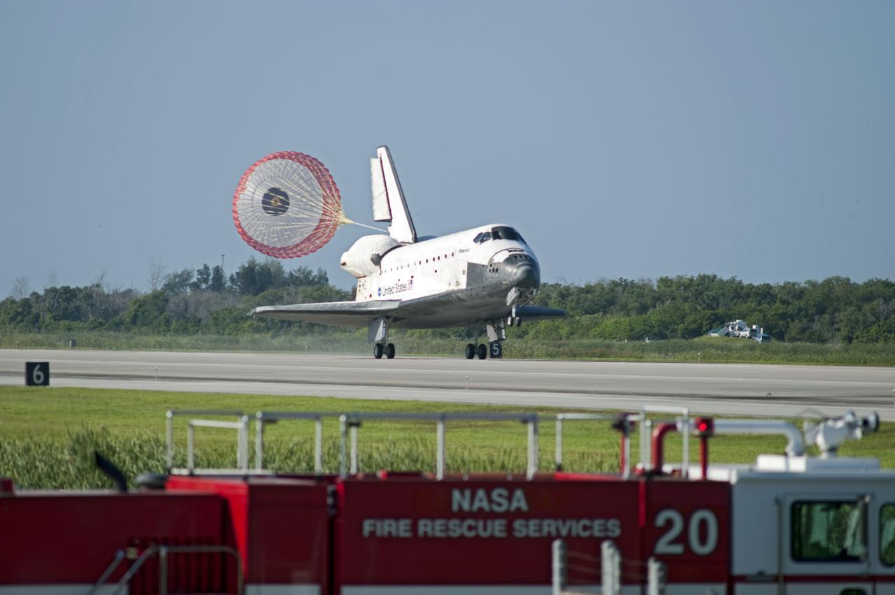 STS132-S-092 (26 May 2010) --- Space shuttle Atlantis? drag chute is deployed as the spacecraft rolls toward wheels stop on Runway 33 at the Shuttle Landing Facility at NASA's Kennedy Space Center in Florida. Landing was at 8:48 a.m. (EDT) on May 26, 2010, completing the 12-day STS-132 mission to the International Space Station. Main gear touchdown was at 8:48:11 a.m., followed by nose gear touchdown at 8:48:21 a.m. and wheelstop at 8:49:18 a.m. Onboard are NASA astronauts Ken Ham, commander; Tony Antonelli, pilot; Garrett Reisman, Michael Good, Steve Bowen and Piers Sellers, all mission specialists. The six-member STS-132 crew carried the Russian-built Mini Research Module 1 (MRM1) to the orbital complex. STS-132 is the 34th shuttle mission to the station, the 132nd shuttle mission overall and the last planned flight for Atlantis.
