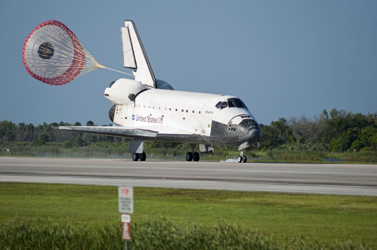 STS132-S-093 (26 May 2010) --- Space shuttle Atlantis? drag chute is deployed as the spacecraft rolls toward wheels stop on Runway 33 at the Shuttle Landing Facility at NASA's Kennedy Space Center in Florida. Landing was at 8:48 a.m. (EDT) on May 26, 2010, completing the 12-day STS-132 mission to the International Space Station. Main gear touchdown was at 8:48:11 a.m., followed by nose gear touchdown at 8:48:21 a.m. and wheelstop at 8:49:18 a.m. Onboard are NASA astronauts Ken Ham, commander; Tony Antonelli, pilot; Garrett Reisman, Michael Good, Steve Bowen and Piers Sellers, all mission specialists. The six-member STS-132 crew carried the Russian-built Mini Research Module 1 (MRM1) to the orbital complex. STS-132 is the 34th shuttle mission to the station, the 132nd shuttle mission overall and the last planned flight for Atlantis.