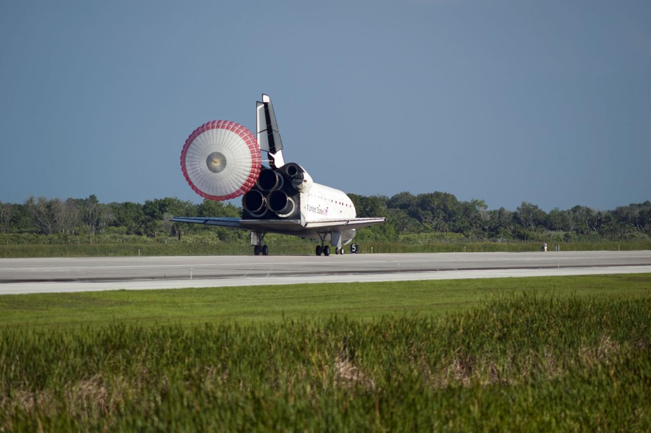 STS132-S-094 (26 May 2010) --- Space shuttle Atlantis? drag chute is deployed as the spacecraft rolls toward wheels stop on Runway 33 at the Shuttle Landing Facility at NASA's Kennedy Space Center in Florida. Landing was at 8:48 a.m. (EDT) on May 26, 2010, completing the 12-day STS-132 mission to the International Space Station. Main gear touchdown was at 8:48:11 a.m., followed by nose gear touchdown at 8:48:21 a.m. and wheelstop at 8:49:18 a.m. Onboard are NASA astronauts Ken Ham, commander; Tony Antonelli, pilot; Garrett Reisman, Michael Good, Steve Bowen and Piers Sellers, all mission specialists. The six-member STS-132 crew carried the Russian-built Mini Research Module 1 (MRM1) to the orbital complex. STS-132 is the 34th shuttle mission to the station, the 132nd shuttle mission overall and the last planned flight for Atlantis.