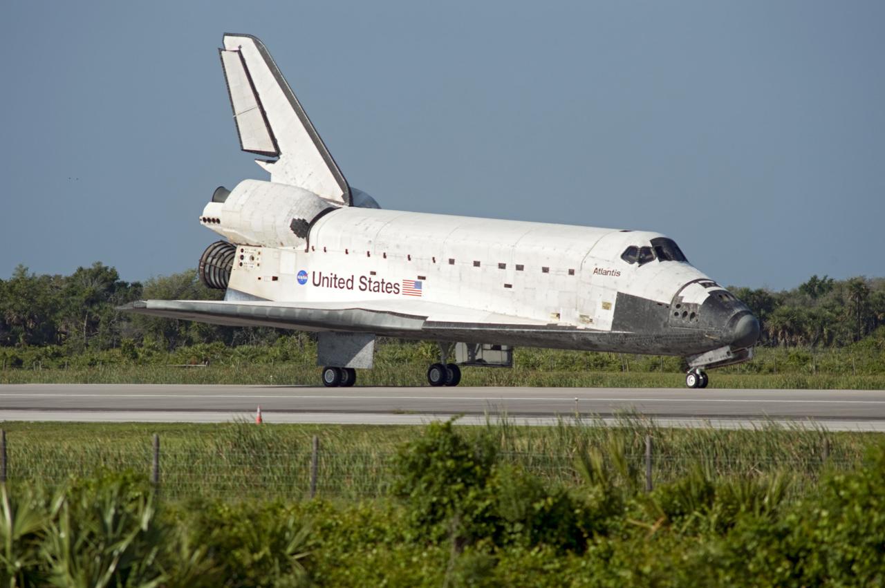 STS132-S-099 (26 May 2010) --- Space shuttle Atlantis rolls to a stop on Runway 33 at the Shuttle Landing Facility at NASA's Kennedy Space Center in Florida. Landing was at 8:48 a.m. (EDT) on May 26, 2010, completing the 12-day STS-132 mission to the International Space Station. Main gear touchdown was at 8:48:11 a.m., followed by nose gear touchdown at 8:48:21 a.m. and wheelstop at 8:49:18 a.m. Onboard are NASA astronauts Ken Ham, commander; Tony Antonelli, pilot; Garrett Reisman, Michael Good, Steve Bowen and Piers Sellers, all mission specialists. The six-member STS-132 crew carried the Russian-built Mini Research Module 1 (MRM1) to the orbital complex. STS-132 is the 34th shuttle mission to the station, the 132nd shuttle mission overall and the last planned flight for Atlantis.