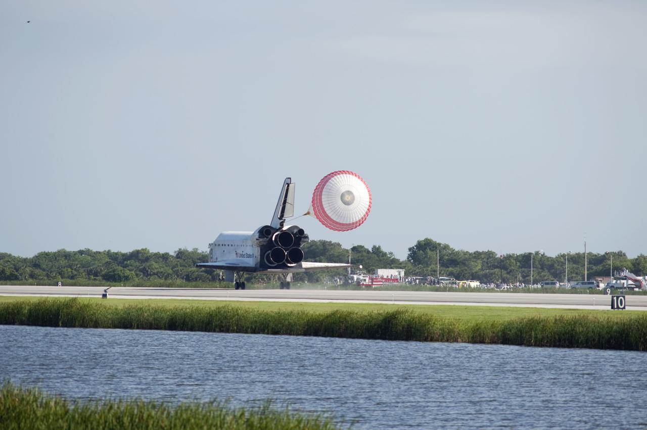 STS132-S-104 (26 May 2010) --- Space shuttle Atlantis? drag chute is deployed as the spacecraft rolls toward wheels stop on Runway 33 at the Shuttle Landing Facility at NASA's Kennedy Space Center in Florida. Landing was at 8:48 a.m. (EDT) on May 26, 2010, completing the 12-day STS-132 mission to the International Space Station. Main gear touchdown was at 8:48:11 a.m., followed by nose gear touchdown at 8:48:21 a.m. and wheelstop at 8:49:18 a.m. Onboard are NASA astronauts Ken Ham, commander; Tony Antonelli, pilot; Garrett Reisman, Michael Good, Steve Bowen and Piers Sellers, all mission specialists. The six-member STS-132 crew carried the Russian-built Mini Research Module 1 (MRM1) to the orbital complex. STS-132 is the 34th shuttle mission to the station, the 132nd shuttle mission overall and the last planned flight for Atlantis.
