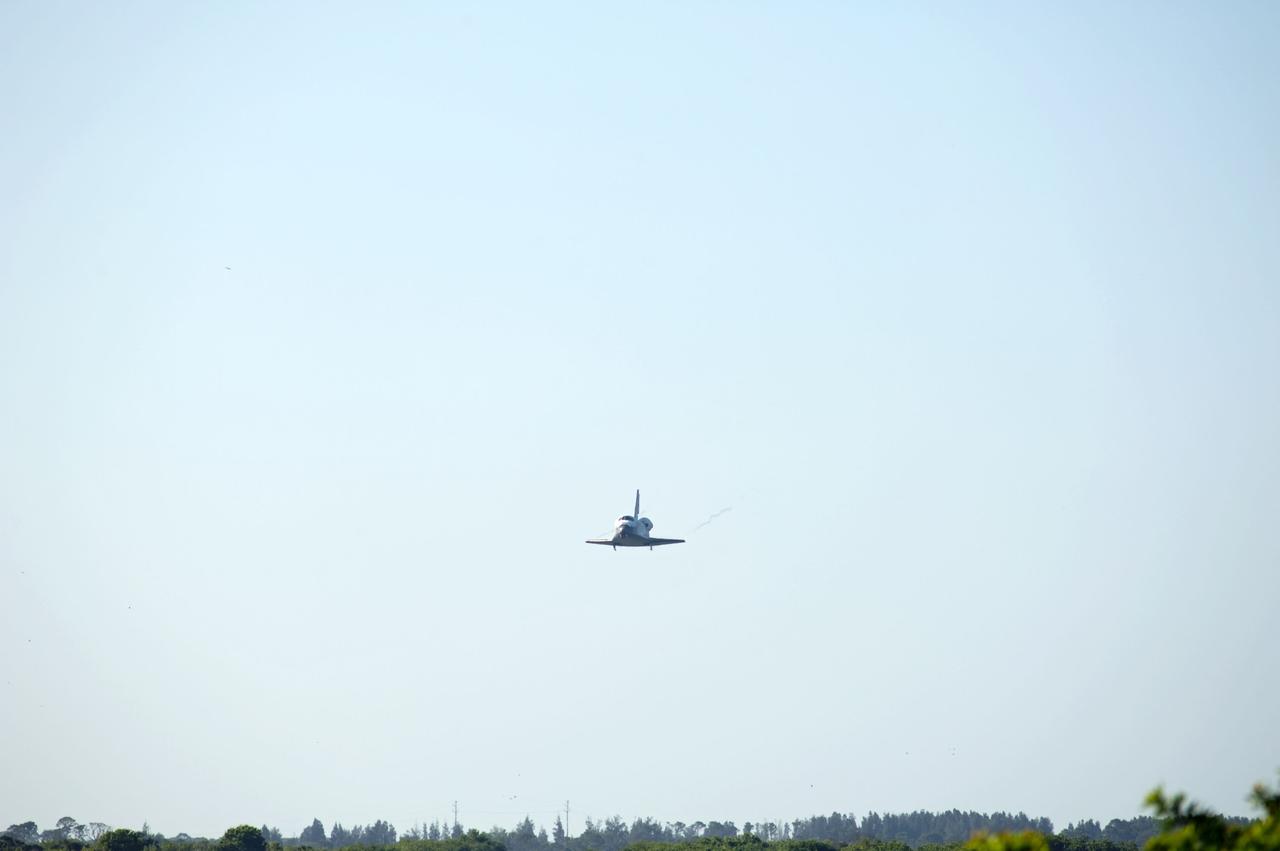 STS132-S-105 (26 May 2010) --- Coming in from the southeast, space shuttle Atlantis approaches Runway 33 at the Shuttle Landing Facility at NASA's Kennedy Space Center in Florida. Landing was at 8:48 a.m. (EDT) on May 26, 2010, completing the 12-day STS-132 mission to the International Space Station. Main gear touchdown was at 8:48:11 a.m., followed by nose gear touchdown at 8:48:21 a.m. and wheelstop at 8:49:18 a.m. Onboard are NASA astronauts Ken Ham, commander; Tony Antonelli, pilot; Garrett Reisman, Michael Good, Steve Bowen and Piers Sellers, all mission specialists. The six-member STS-132 crew carried the Russian-built Mini Research Module 1 (MRM1) to the orbital complex. STS-132 is the 34th shuttle mission to the station, the 132nd shuttle mission overall and the last planned flight for Atlantis.