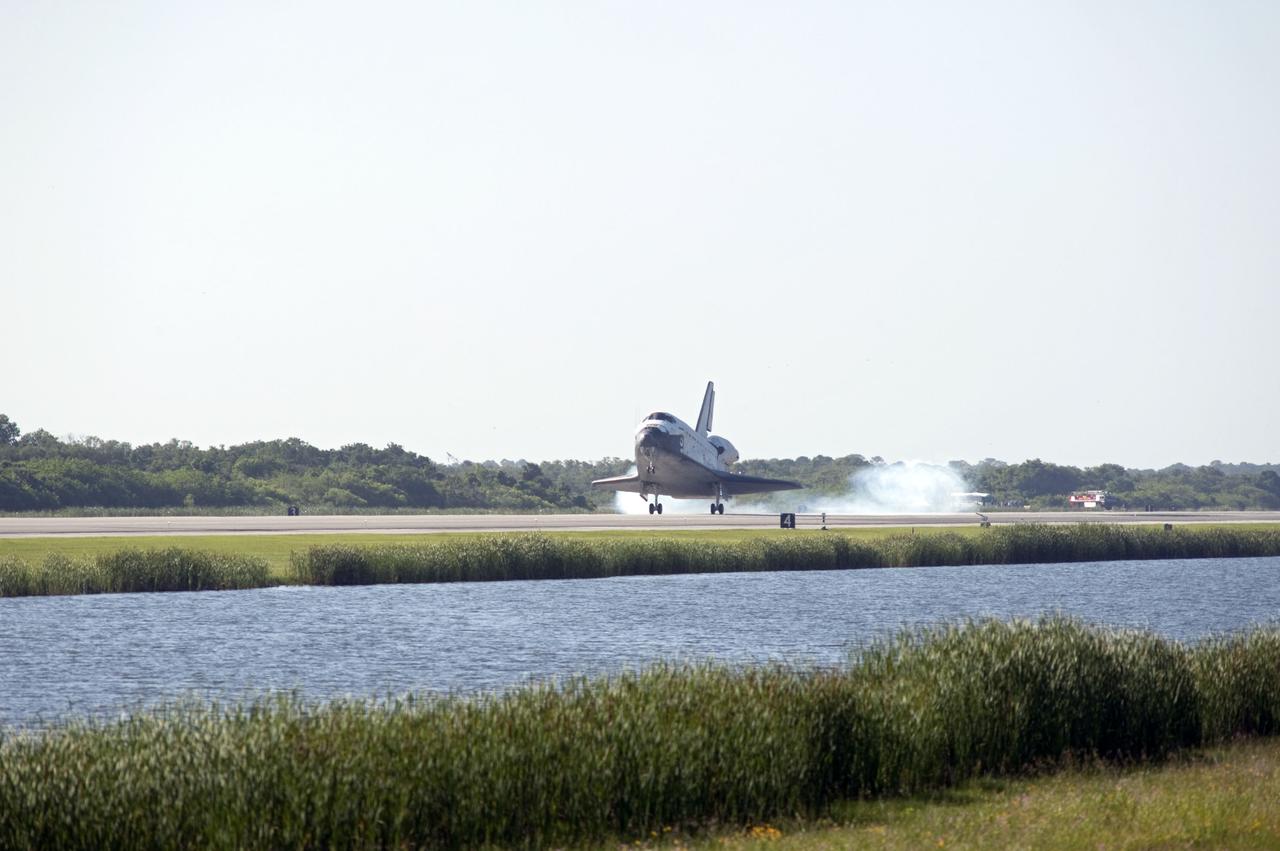 STS132-S-106 (26 May 2010) --- Space shuttle Atlantis' main gear touches down on Runway 33 at the Shuttle Landing Facility at NASA's Kennedy Space Center in Florida. Landing was at 8:48 a.m. (EDT) on May 26, 2010, completing the 12-day STS-132 mission to the International Space Station. Main gear touchdown was at 8:48:11 a.m., followed by nose gear touchdown at 8:48:21 a.m. and wheelstop at 8:49:18 a.m. Onboard are NASA astronauts Ken Ham, commander; Tony Antonelli, pilot; Garrett Reisman, Michael Good, Steve Bowen and Piers Sellers, all mission specialists. The six-member STS-132 crew carried the Russian-built Mini Research Module 1 (MRM1) to the orbital complex. STS-132 is the 34th shuttle mission to the station, the 132nd shuttle mission overall and the last planned flight for Atlantis.