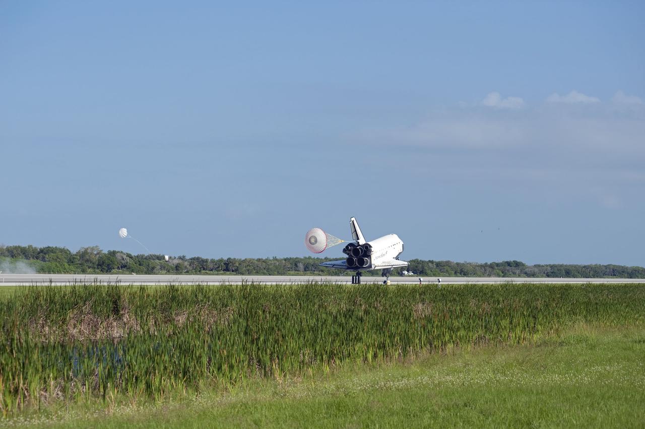 STS132-S-110 (26 May 2010) --- Space shuttle Atlantis? drag chute is deployed as the spacecraft rolls toward wheels stop on Runway 33 at the Shuttle Landing Facility at NASA's Kennedy Space Center in Florida. Landing was at 8:48 a.m. (EDT) on May 26, 2010, completing the 12-day STS-132 mission to the International Space Station. Main gear touchdown was at 8:48:11 a.m., followed by nose gear touchdown at 8:48:21 a.m. and wheelstop at 8:49:18 a.m. Onboard are NASA astronauts Ken Ham, commander; Tony Antonelli, pilot; Garrett Reisman, Michael Good, Steve Bowen and Piers Sellers, all mission specialists. The six-member STS-132 crew carried the Russian-built Mini Research Module 1 (MRM1) to the orbital complex. STS-132 is the 34th shuttle mission to the station, the 132nd shuttle mission overall and the last planned flight for Atlantis.
