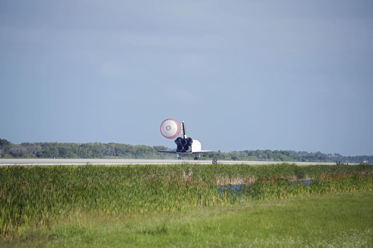STS132-S-111 (26 May 2010) --- Space shuttle Atlantis? drag chute is deployed as the spacecraft rolls toward wheels stop on Runway 33 at the Shuttle Landing Facility at NASA's Kennedy Space Center in Florida. Landing was at 8:48 a.m. (EDT) on May 26, 2010, completing the 12-day STS-132 mission to the International Space Station. Main gear touchdown was at 8:48:11 a.m., followed by nose gear touchdown at 8:48:21 a.m. and wheelstop at 8:49:18 a.m. Onboard are NASA astronauts Ken Ham, commander; Tony Antonelli, pilot; Garrett Reisman, Michael Good, Steve Bowen and Piers Sellers, all mission specialists. The six-member STS-132 crew carried the Russian-built Mini Research Module 1 (MRM1) to the orbital complex. STS-132 is the 34th shuttle mission to the station, the 132nd shuttle mission overall and the last planned flight for Atlantis.