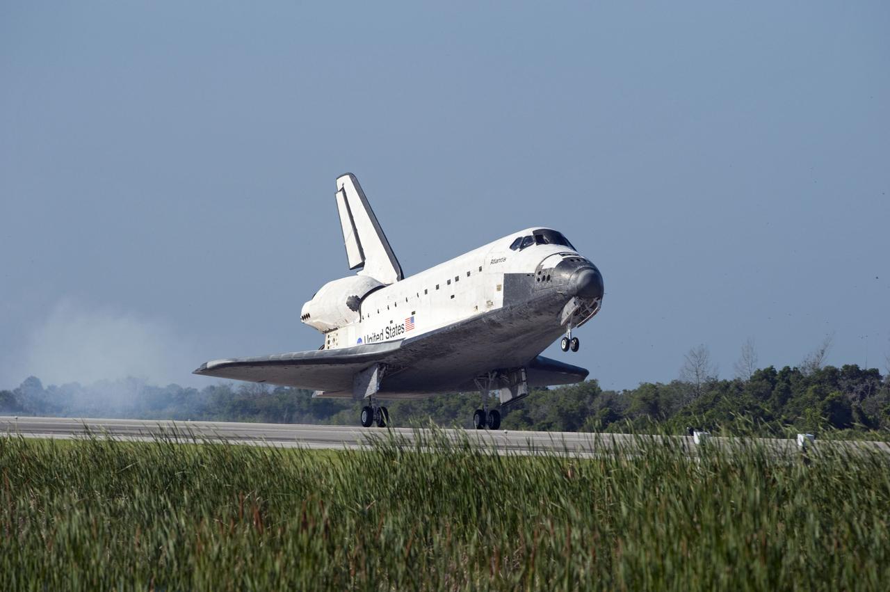 STS132-S-113 (26 May 2010) --- Space shuttle Atlantis' main gear touches down on Runway 33 at the Shuttle Landing Facility at NASA's Kennedy Space Center in Florida. Landing was at 8:48 a.m. (EDT) on May 26, 2010, completing the 12-day STS-132 mission to the International Space Station. Main gear touchdown was at 8:48:11 a.m., followed by nose gear touchdown at 8:48:21 a.m. and wheelstop at 8:49:18 a.m. Onboard are NASA astronauts Ken Ham, commander; Tony Antonelli, pilot; Garrett Reisman, Michael Good, Steve Bowen and Piers Sellers, all mission specialists. The six-member STS-132 crew carried the Russian-built Mini Research Module 1 (MRM1) to the orbital complex. STS-132 is the 34th shuttle mission to the station, the 132nd shuttle mission overall and the last planned flight for Atlantis.