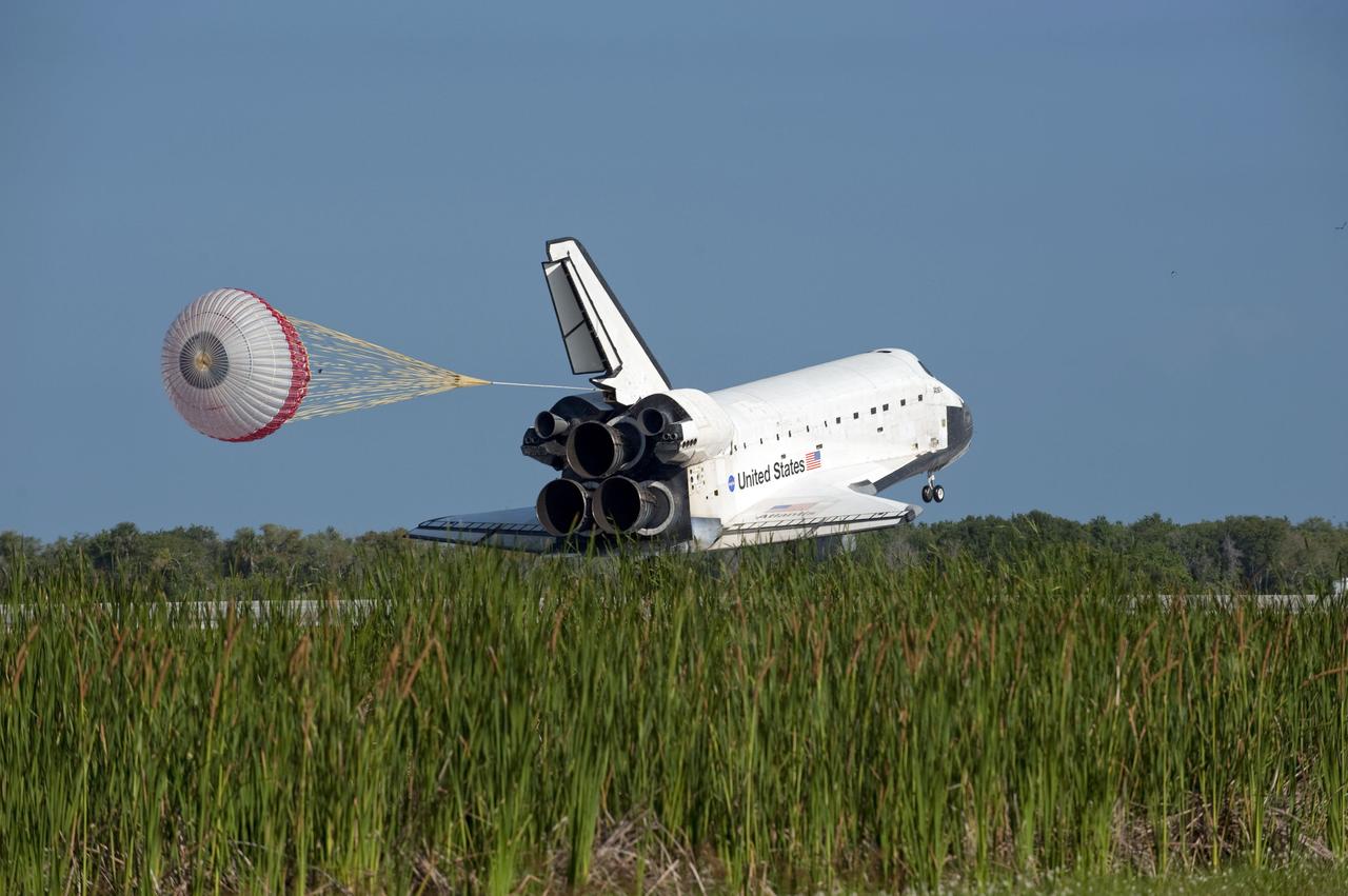 STS132-S-122 (26 May 2010) --- Space shuttle Atlantis? drag chute is deployed as the spacecraft rolls toward wheels stop on Runway 33 at the Shuttle Landing Facility at NASA's Kennedy Space Center in Florida. Landing was at 8:48 a.m. (EDT) on May 26, 2010, completing the 12-day STS-132 mission to the International Space Station. Main gear touchdown was at 8:48:11 a.m., followed by nose gear touchdown at 8:48:21 a.m. and wheelstop at 8:49:18 a.m. Onboard are NASA astronauts Ken Ham, commander; Tony Antonelli, pilot; Garrett Reisman, Michael Good, Steve Bowen and Piers Sellers, all mission specialists. The six-member STS-132 crew carried the Russian-built Mini Research Module 1 (MRM1) to the orbital complex. STS-132 is the 34th shuttle mission to the station, the 132nd shuttle mission overall and the last planned flight for Atlantis.