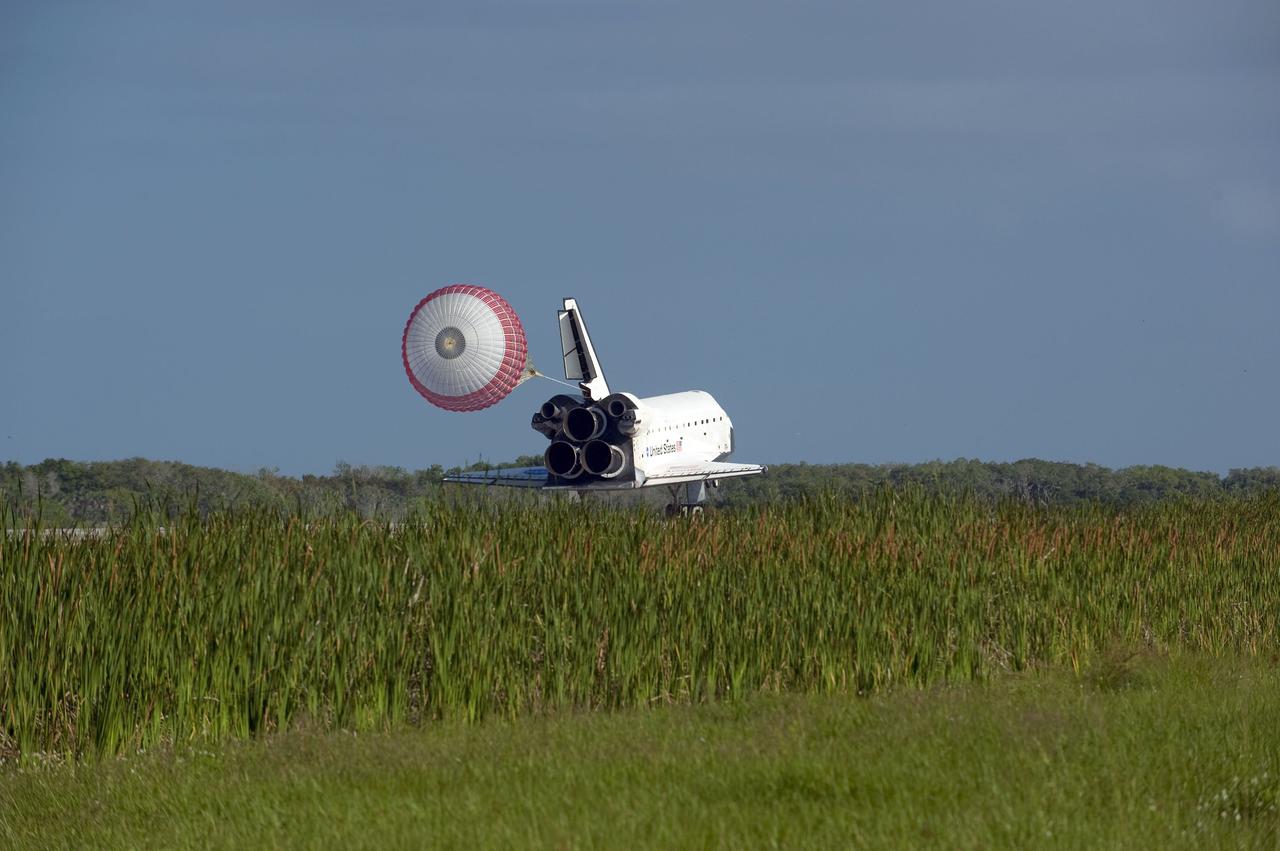 STS132-S-123 (26 May 2010) --- Space shuttle Atlantis? drag chute is deployed as the spacecraft rolls toward wheels stop on Runway 33 at the Shuttle Landing Facility at NASA's Kennedy Space Center in Florida. Landing was at 8:48 a.m. (EDT) on May 26, 2010, completing the 12-day STS-132 mission to the International Space Station. Main gear touchdown was at 8:48:11 a.m., followed by nose gear touchdown at 8:48:21 a.m. and wheelstop at 8:49:18 a.m. Onboard are NASA astronauts Ken Ham, commander; Tony Antonelli, pilot; Garrett Reisman, Michael Good, Steve Bowen and Piers Sellers, all mission specialists. The six-member STS-132 crew carried the Russian-built Mini Research Module 1 (MRM1) to the orbital complex. STS-132 is the 34th shuttle mission to the station, the 132nd shuttle mission overall and the last planned flight for Atlantis.
