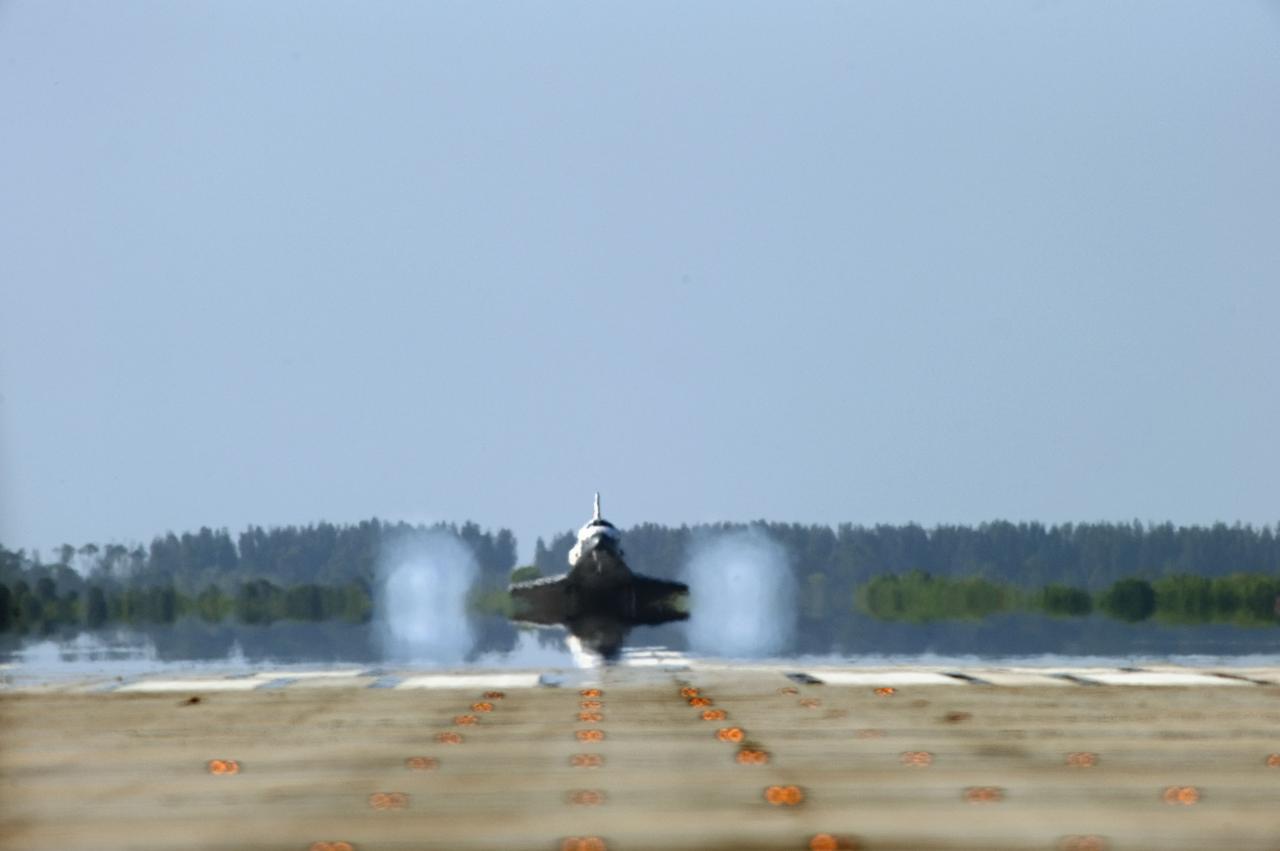 STS132-S-130 (26 May 2010) --- Space shuttle Atlantis lands on Runway 33 at the Shuttle Landing Facility at NASA's Kennedy Space Center in Florida. Landing was at 8:48 a.m. (EDT) on May 26, 2010, completing the 12-day STS-132 mission to the International Space Station. Main gear touchdown was at 8:48:11 a.m., followed by nose gear touchdown at 8:48:21 a.m. and wheelstop at 8:49:18 a.m. Onboard are NASA astronauts Ken Ham, commander; Tony Antonelli, pilot; Garrett Reisman, Michael Good, Steve Bowen and Piers Sellers, all mission specialists. The six-member STS-132 crew carried the Russian-built Mini Research Module 1 (MRM1) to the orbital complex. STS-132 is the 34th shuttle mission to the station, the 132nd shuttle mission overall and the last planned flight for Atlantis.